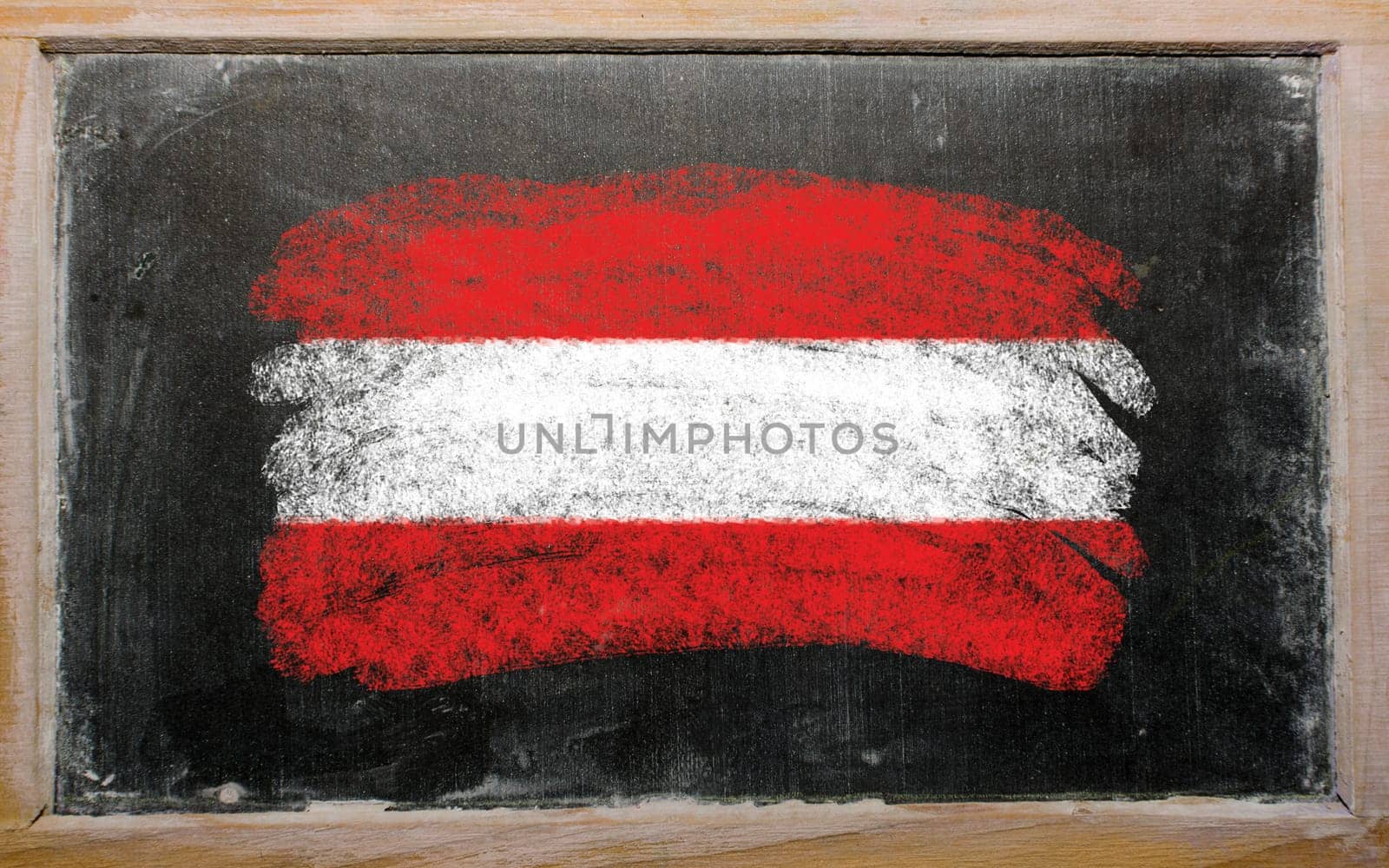 Chalky austrian flag painted with color chalk on old blackboard