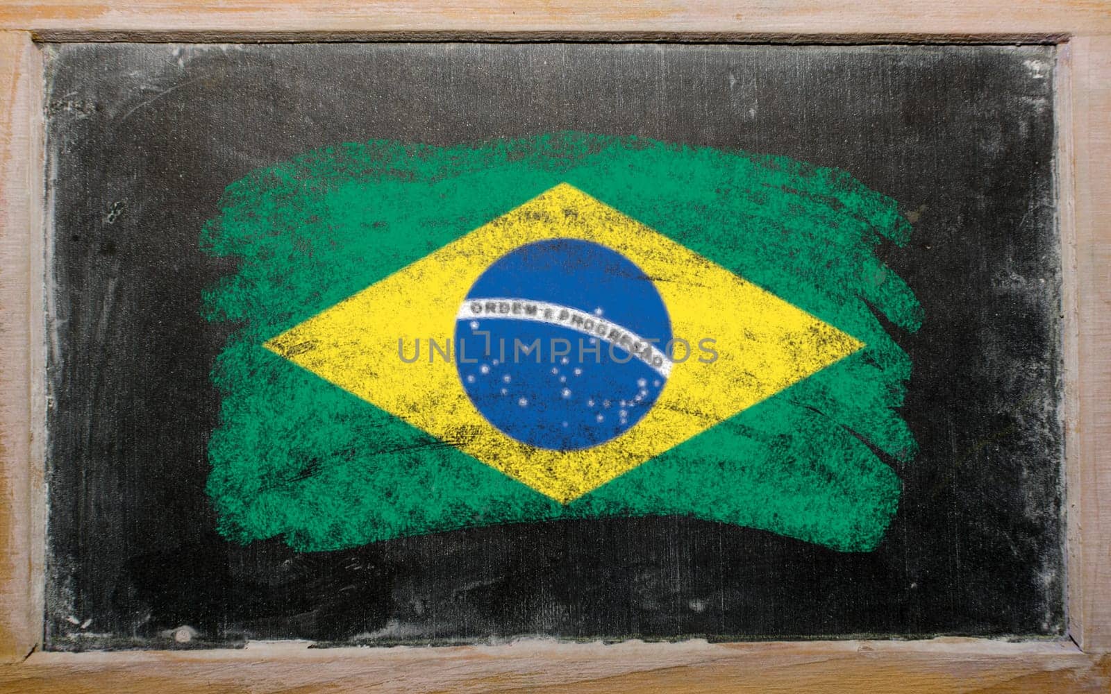 Chalky Brazilian flag painted with color chalk on old blackboard