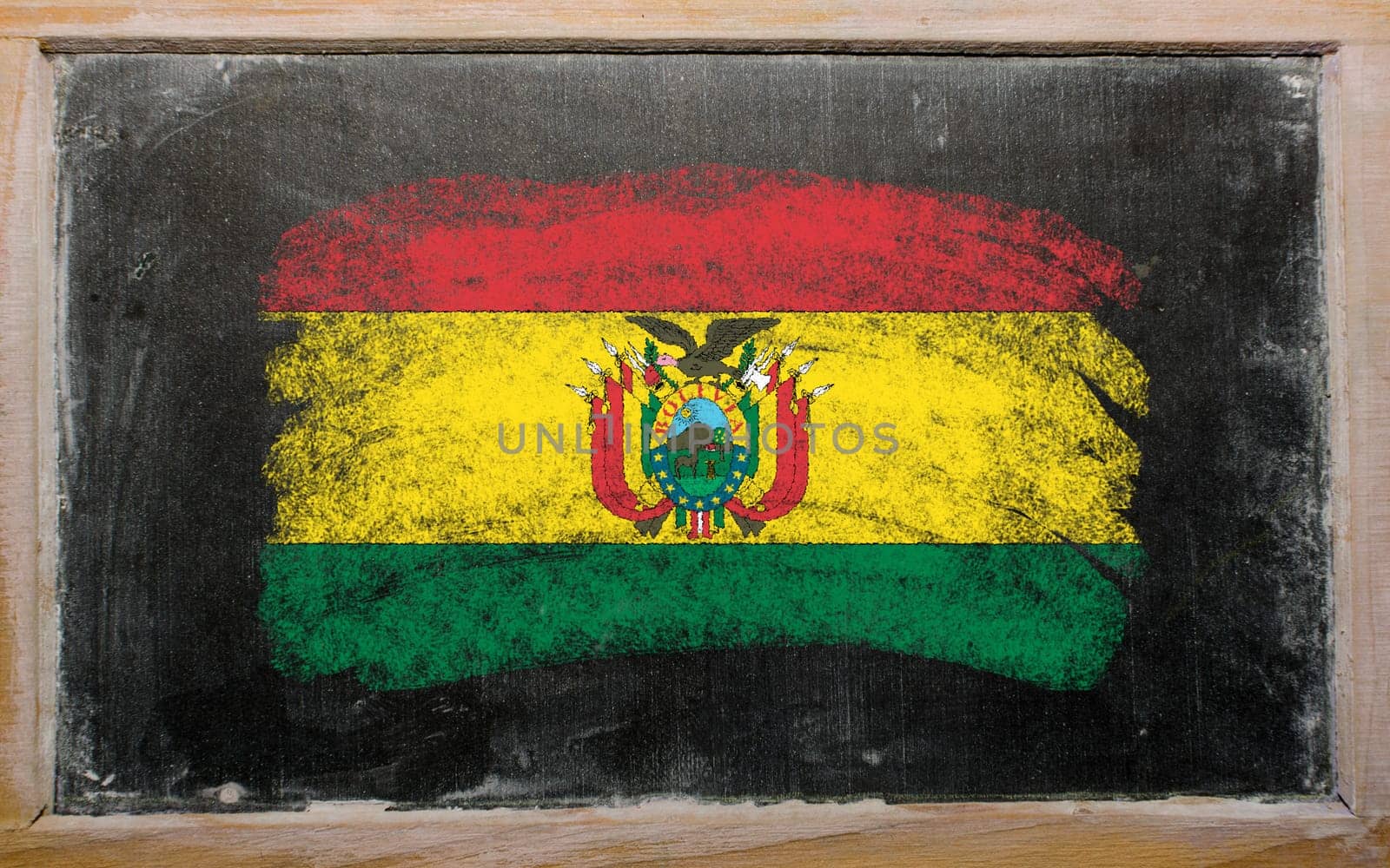 Chalky bolivian flag painted with color chalk on old blackboard