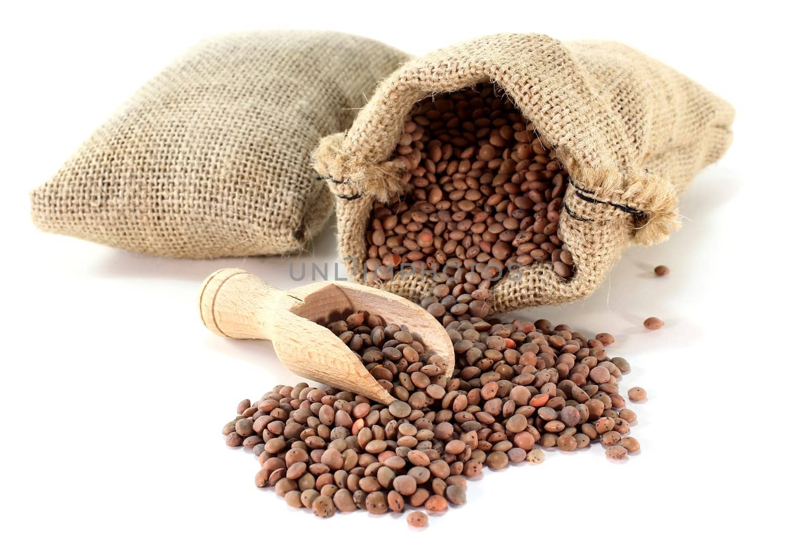a sack filled with mountain lentils against a light background