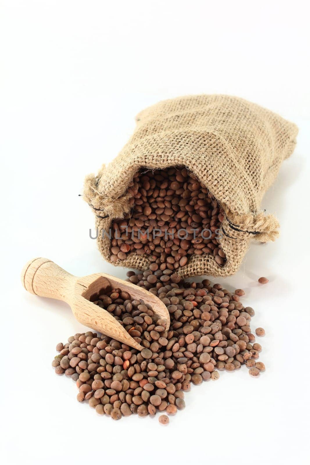 a sack filled with mountain lentils against a light background