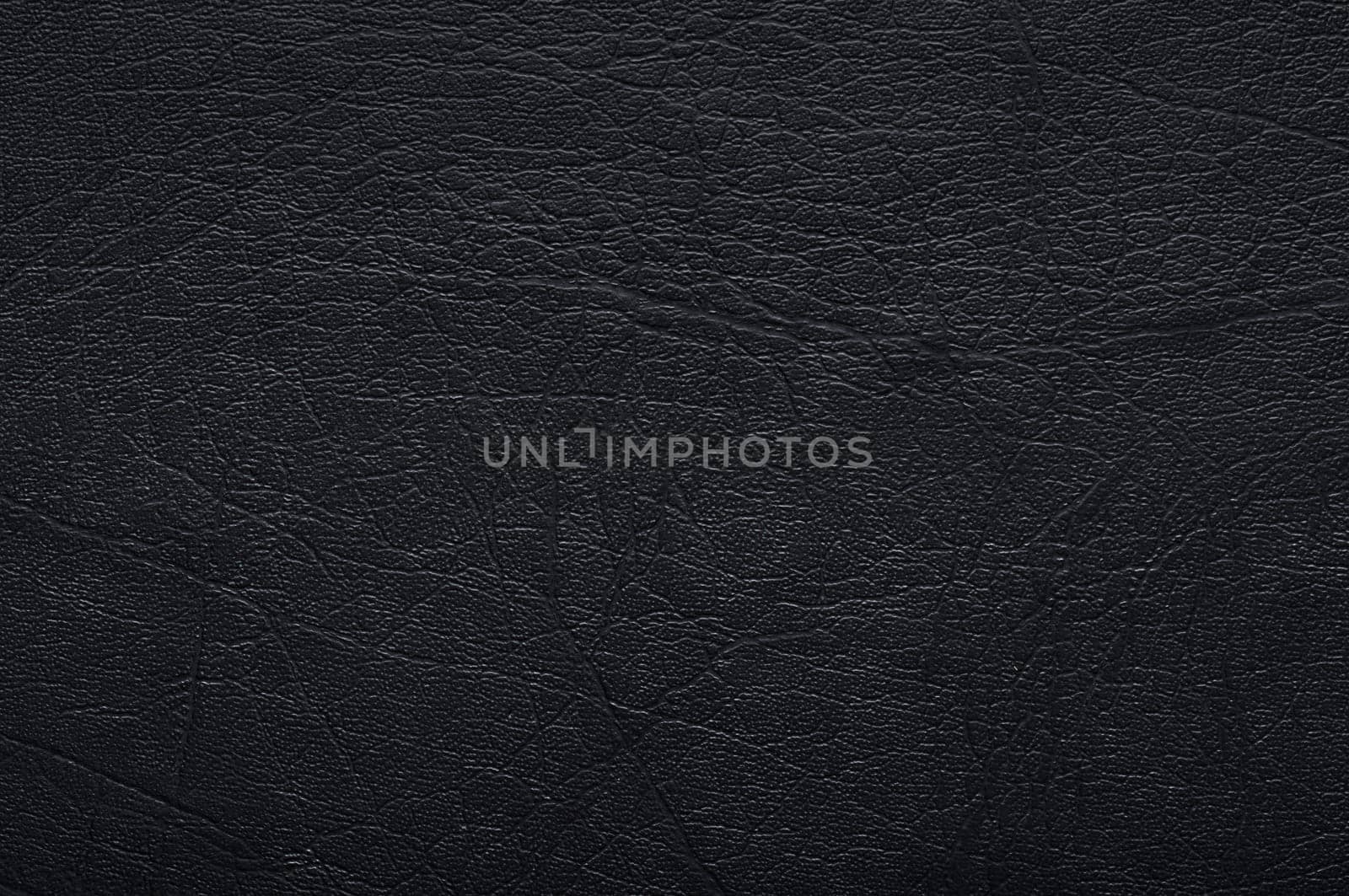 Dark background or texture (leather).