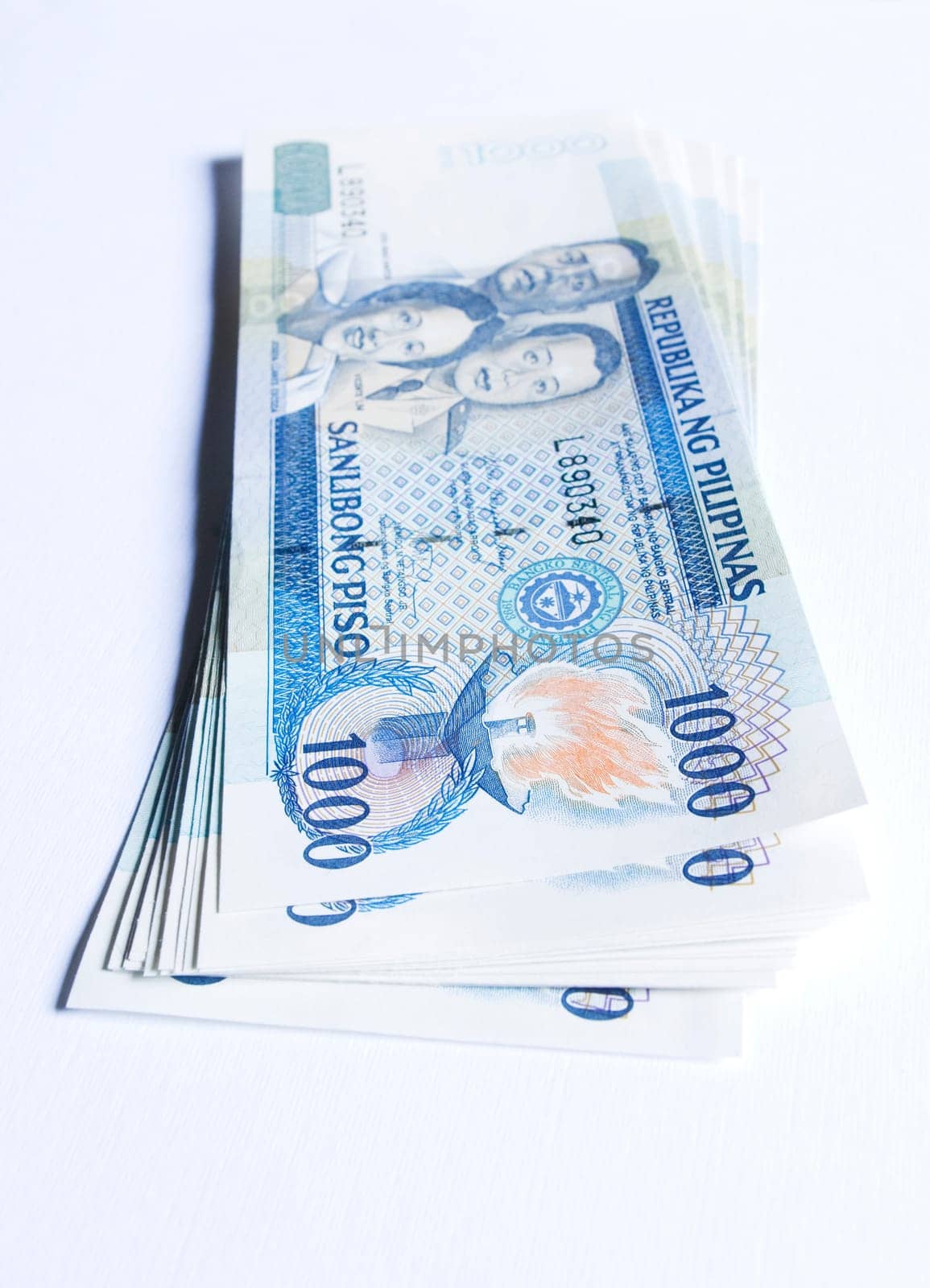 a stack of philippines peso, in one thousand denomination
