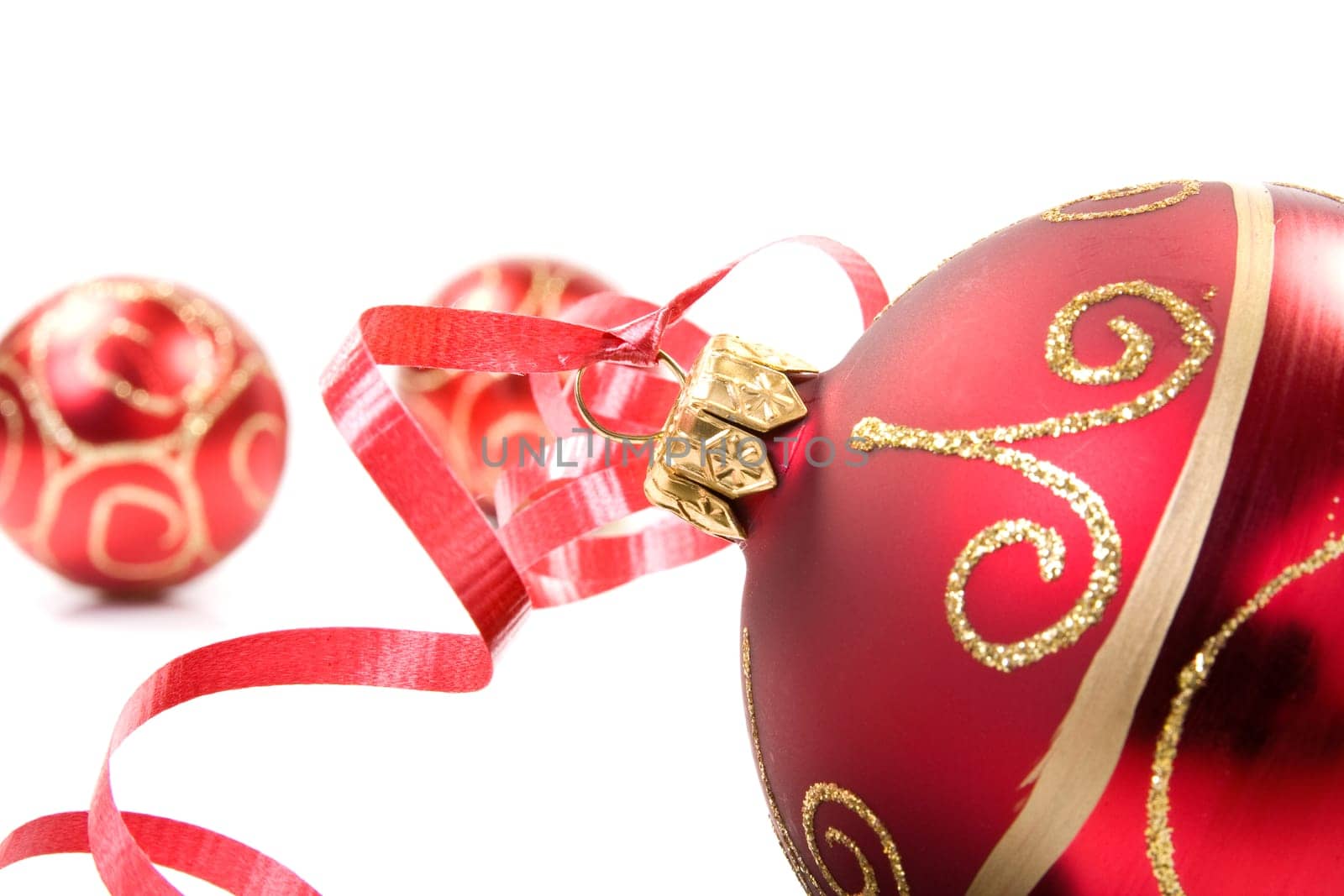 red christmas baubles over a white background