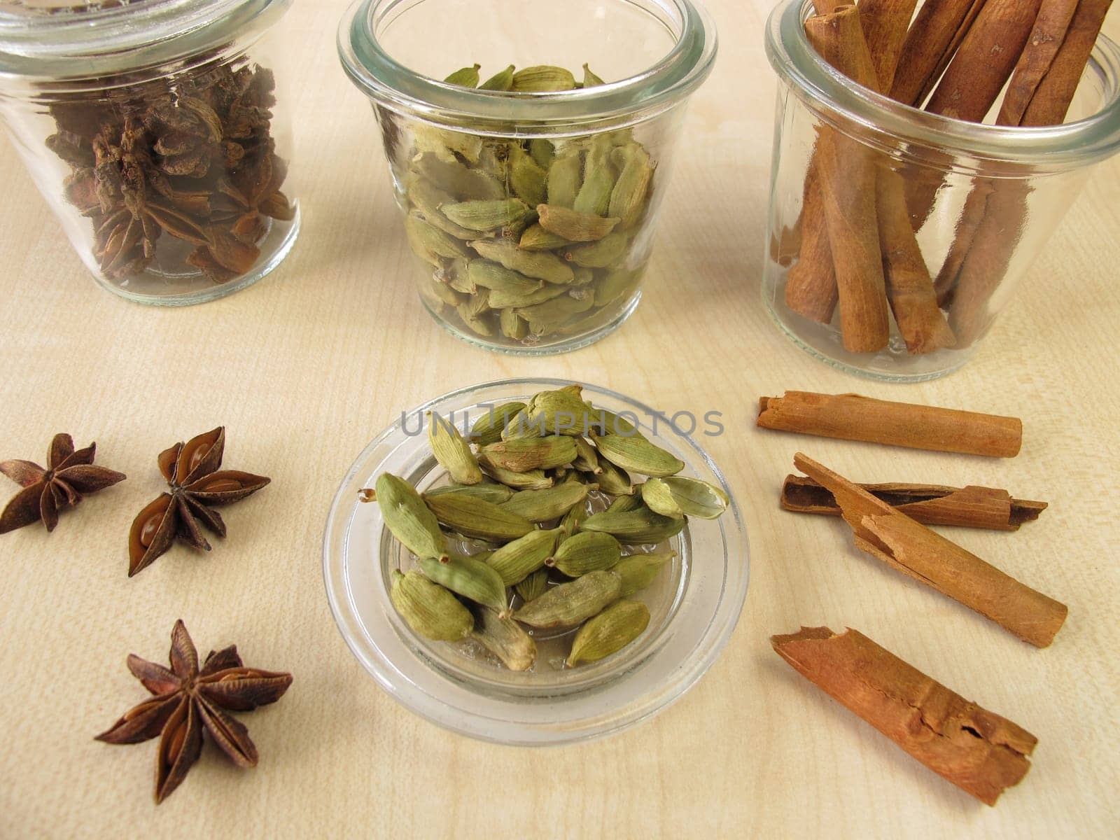 Spice jars with cardamom,cinnamon and star anise