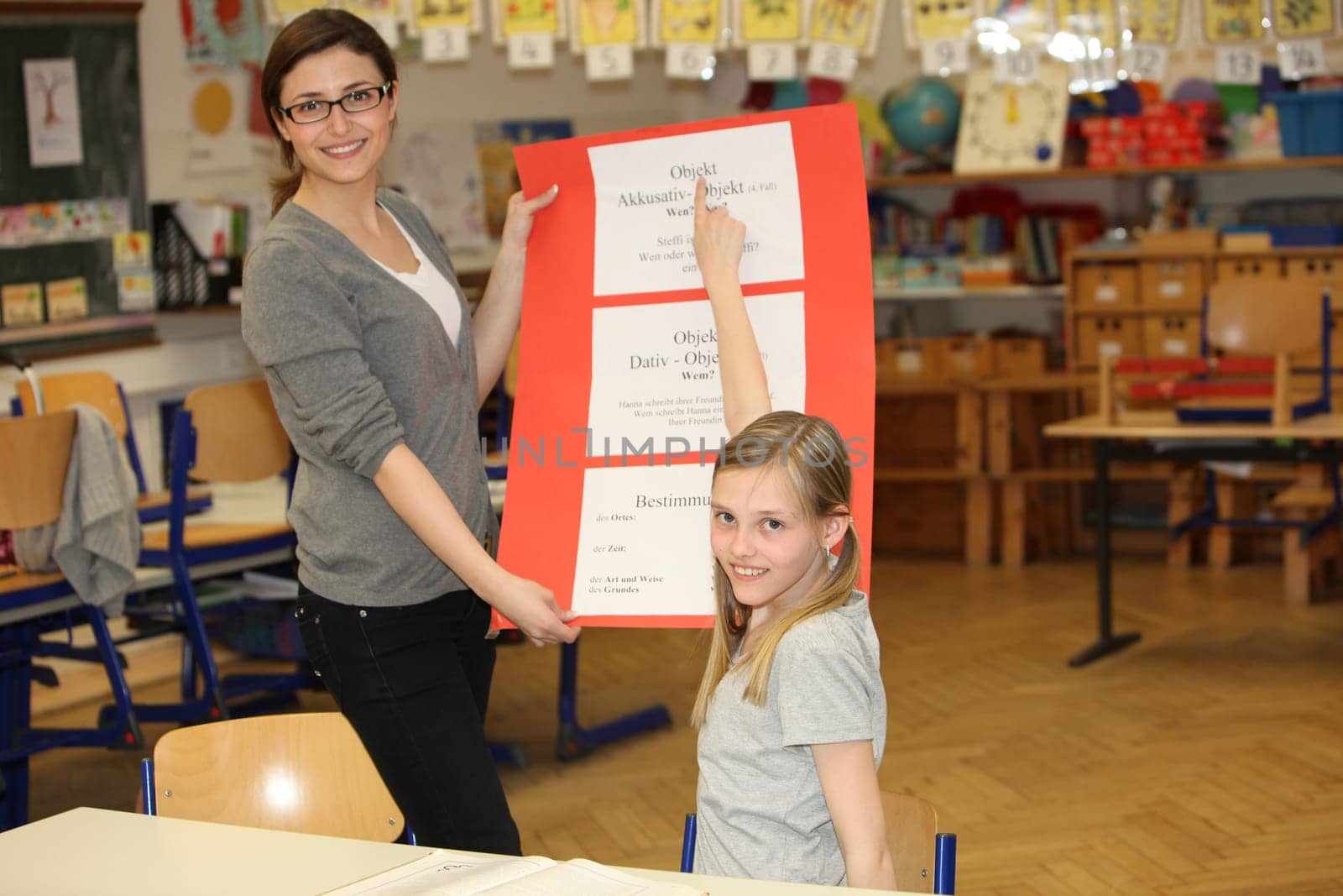 German education - teacher and student in the classroom - horizontally