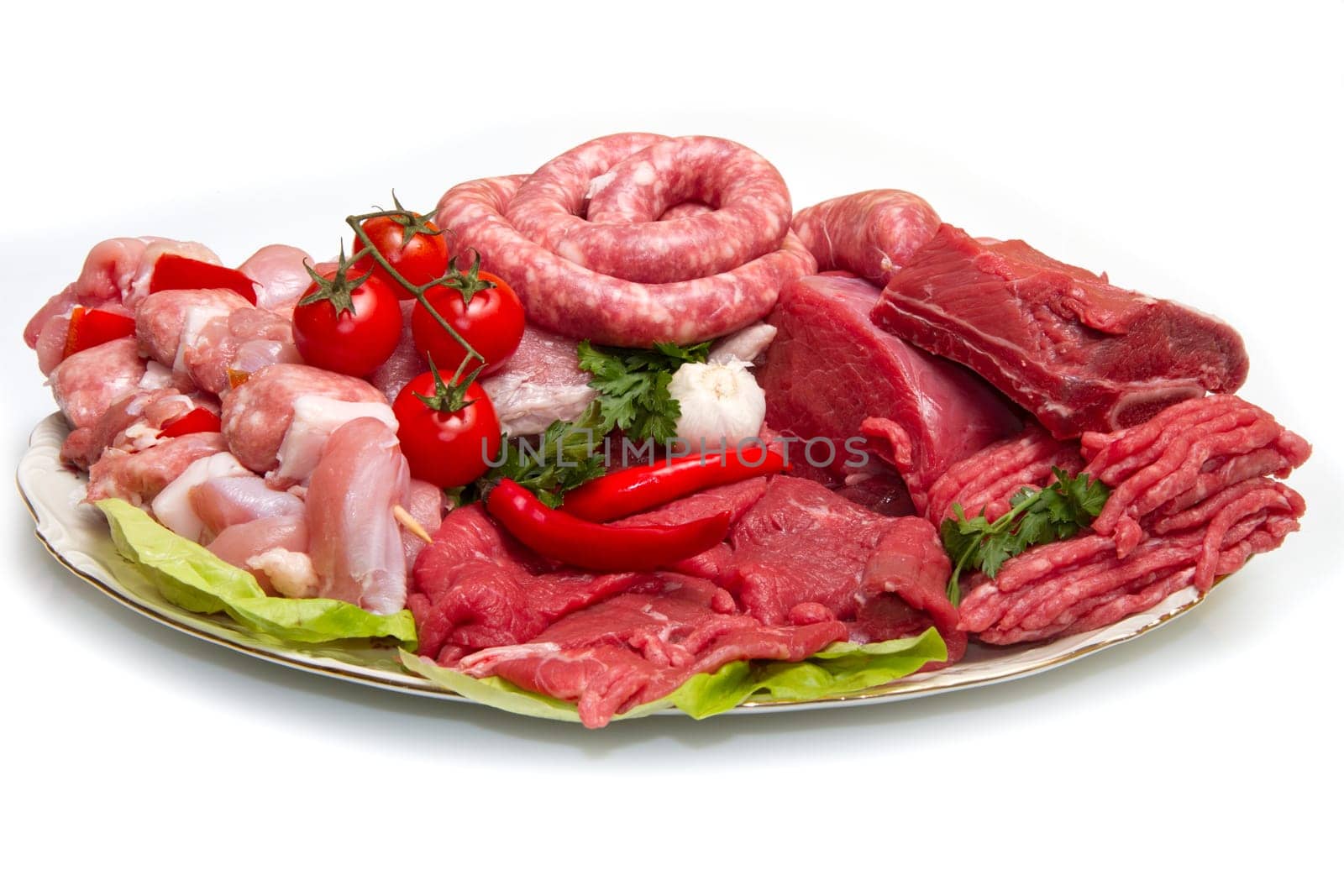 Fresh butcher cut meat assortment garnished