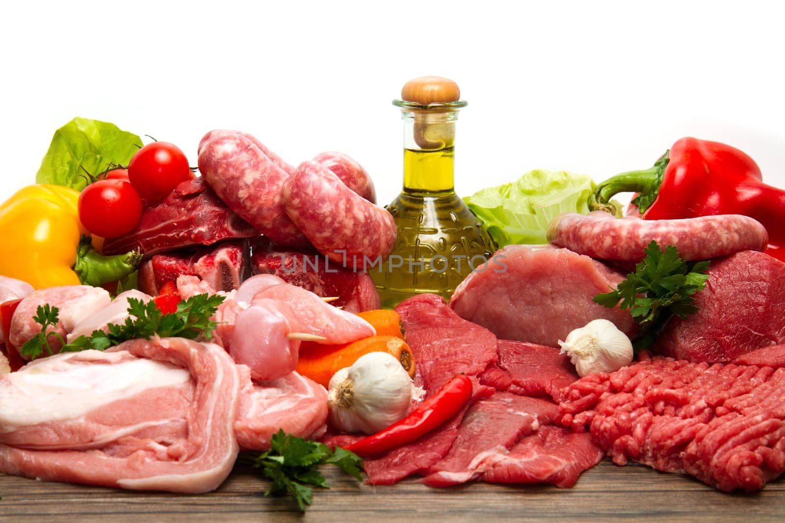 Fresh butcher cut meat assortment garnished