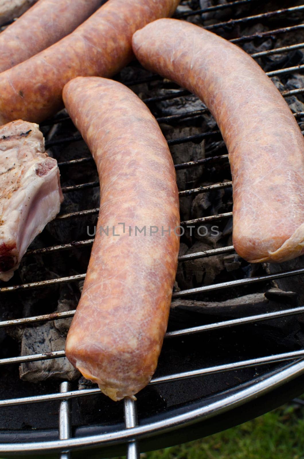 Sausages cooking on the grill