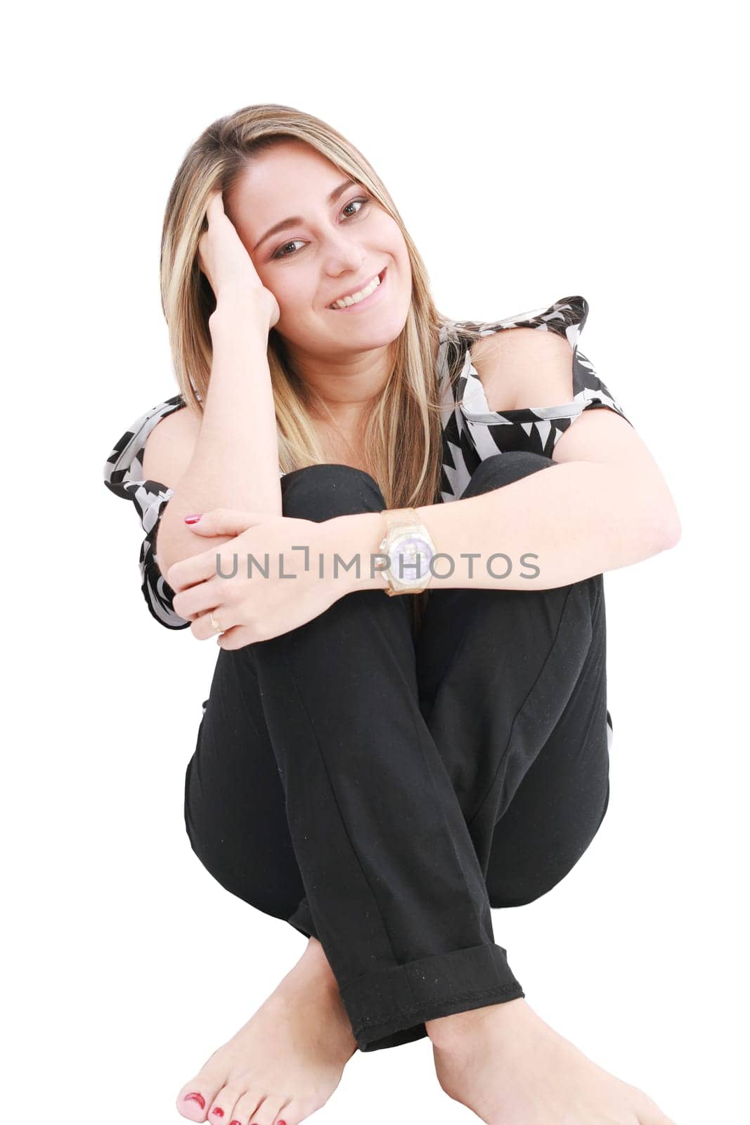 Beautiful girl sitting in the floor, isolated on white
