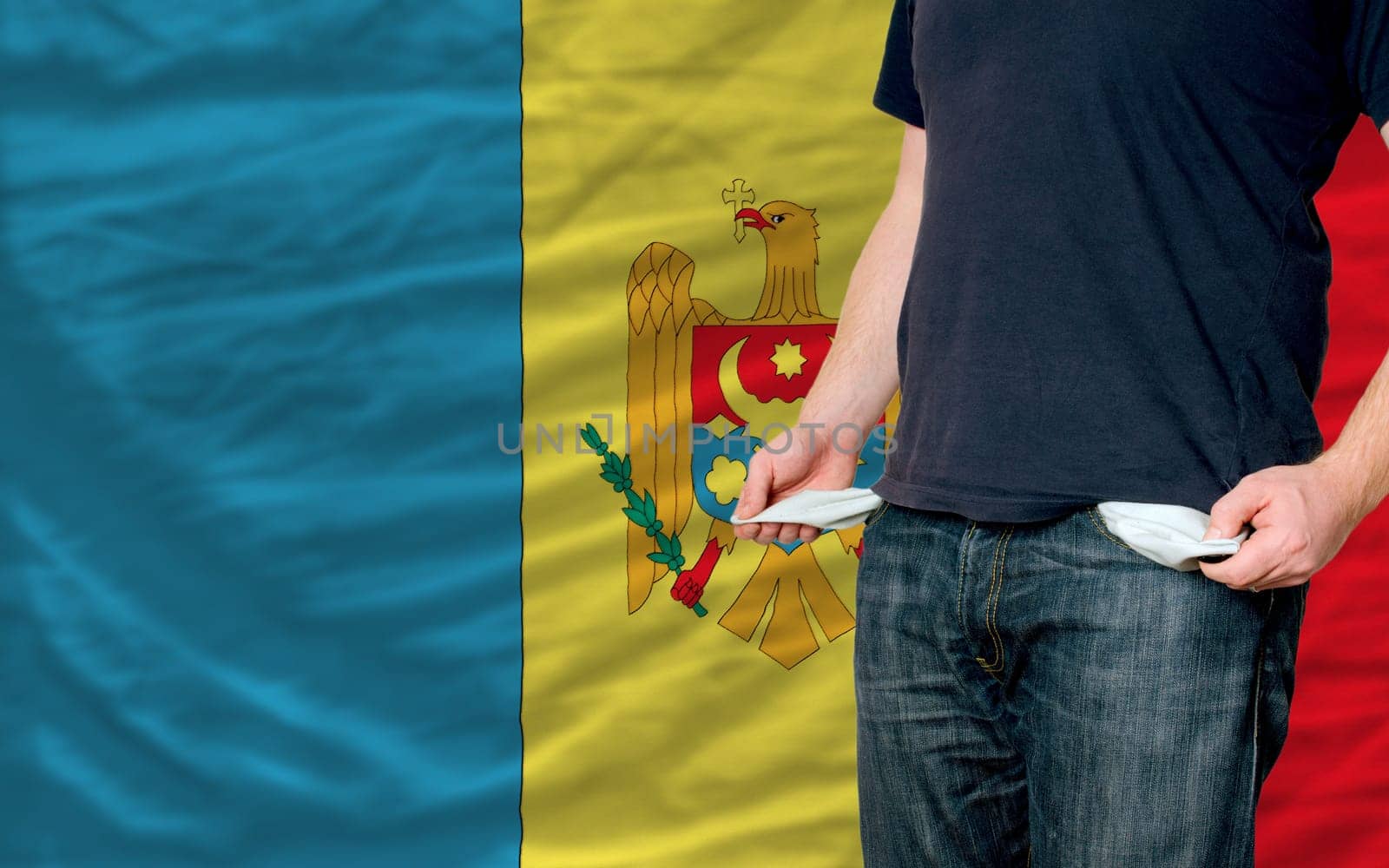 poor man showing empty pockets in front of moldova flag