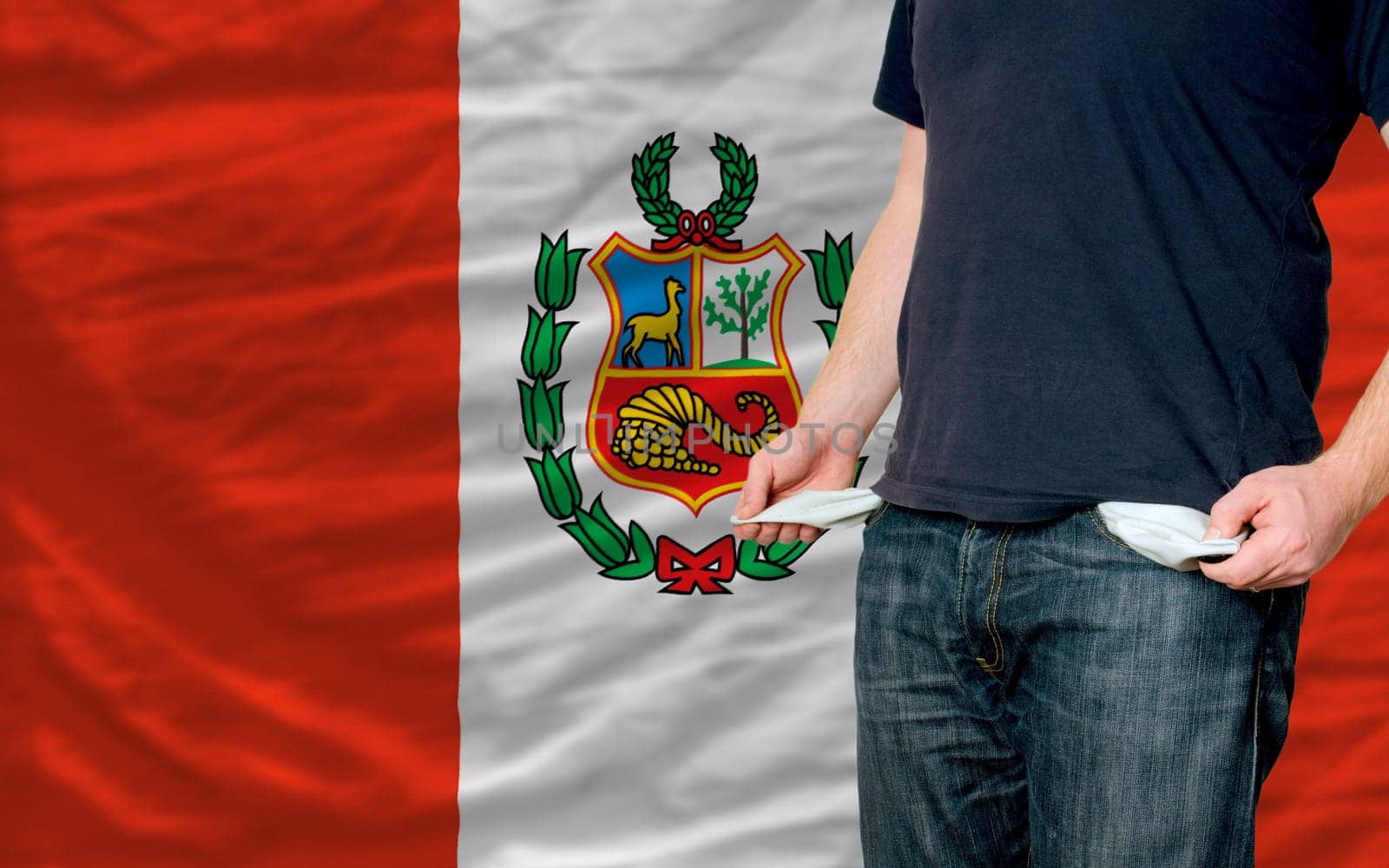poor man showing empty pockets in front of peru flag