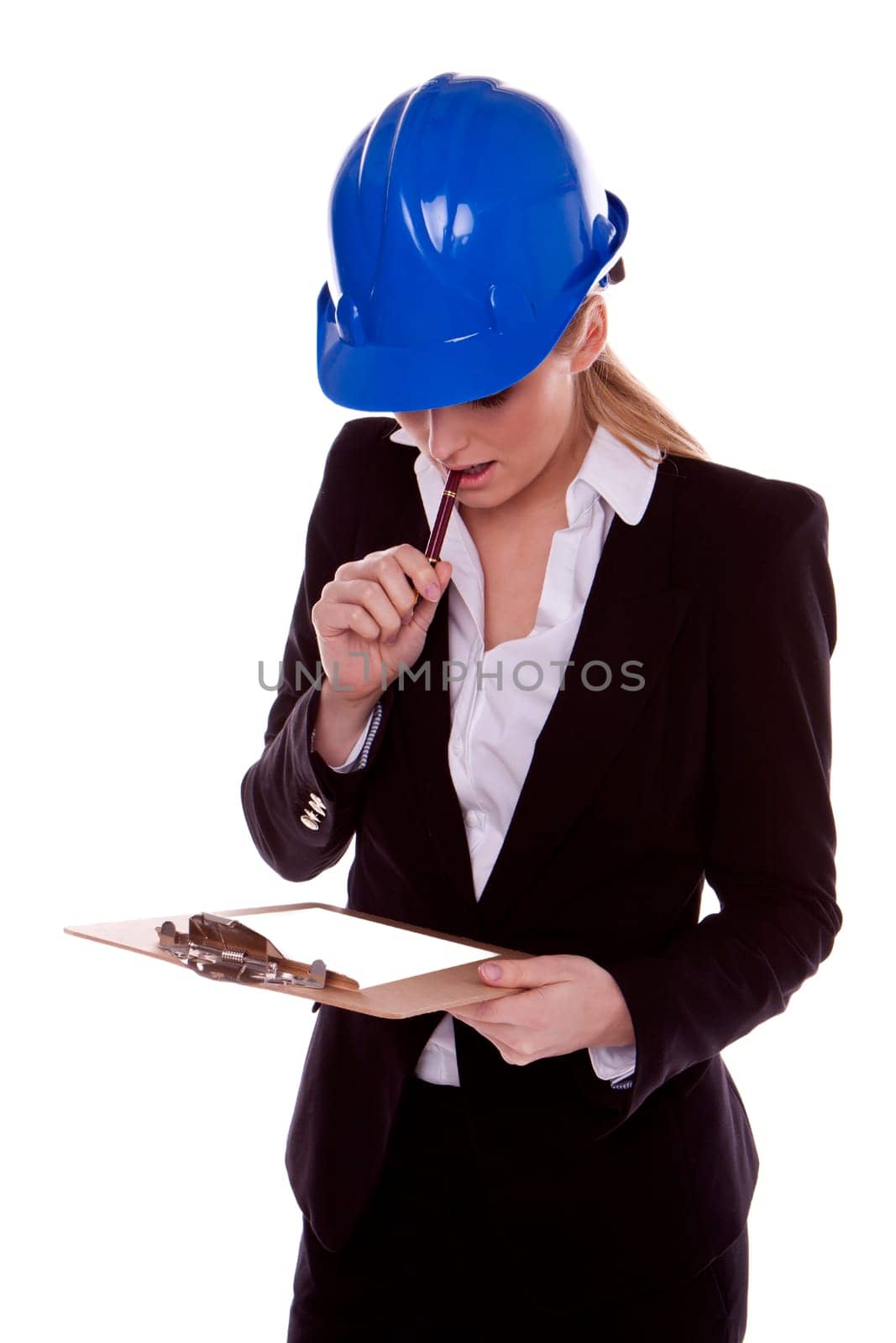 A successful businesswoman standing and wearing a blue safety hardhat.