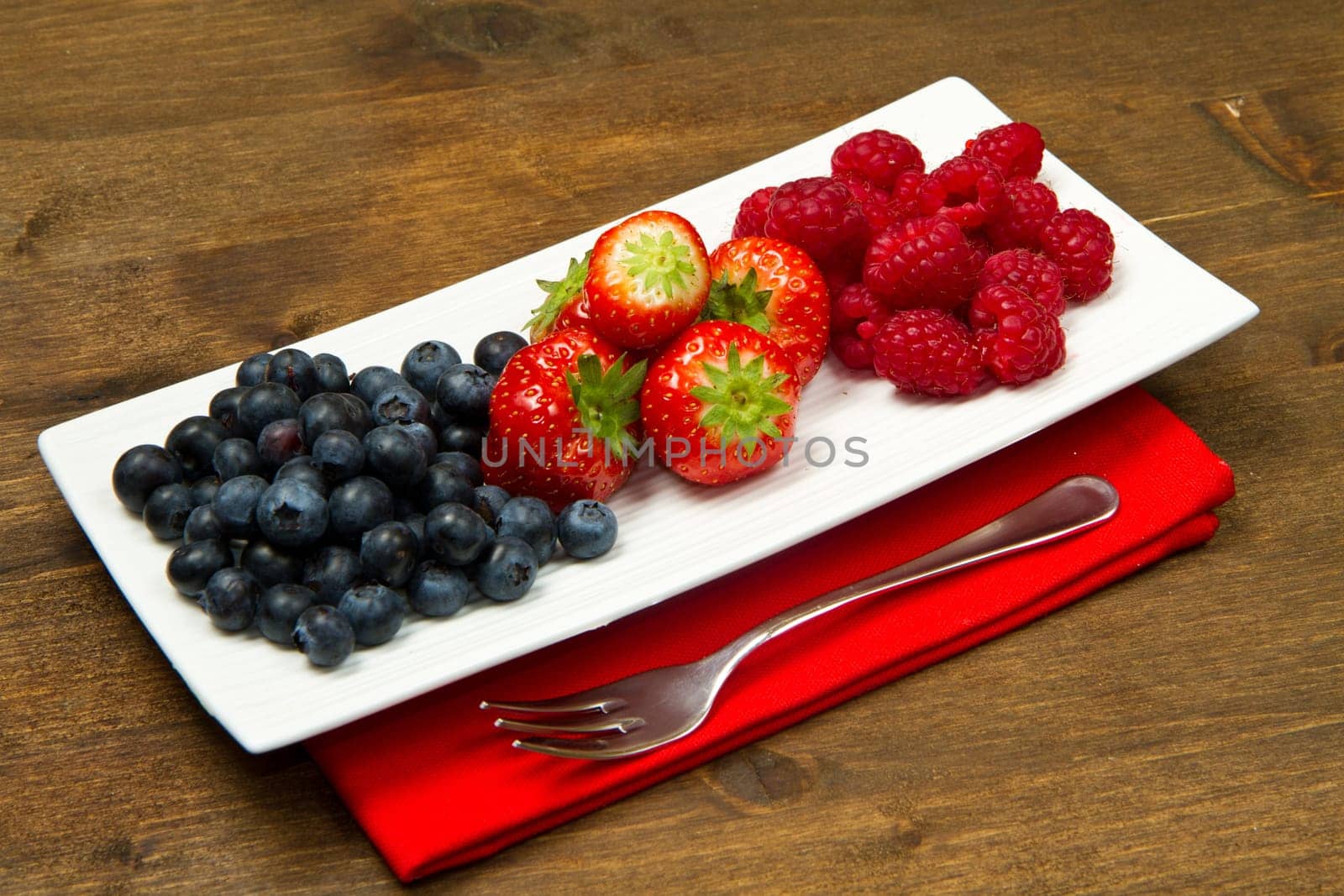 fresh berries on wooden background