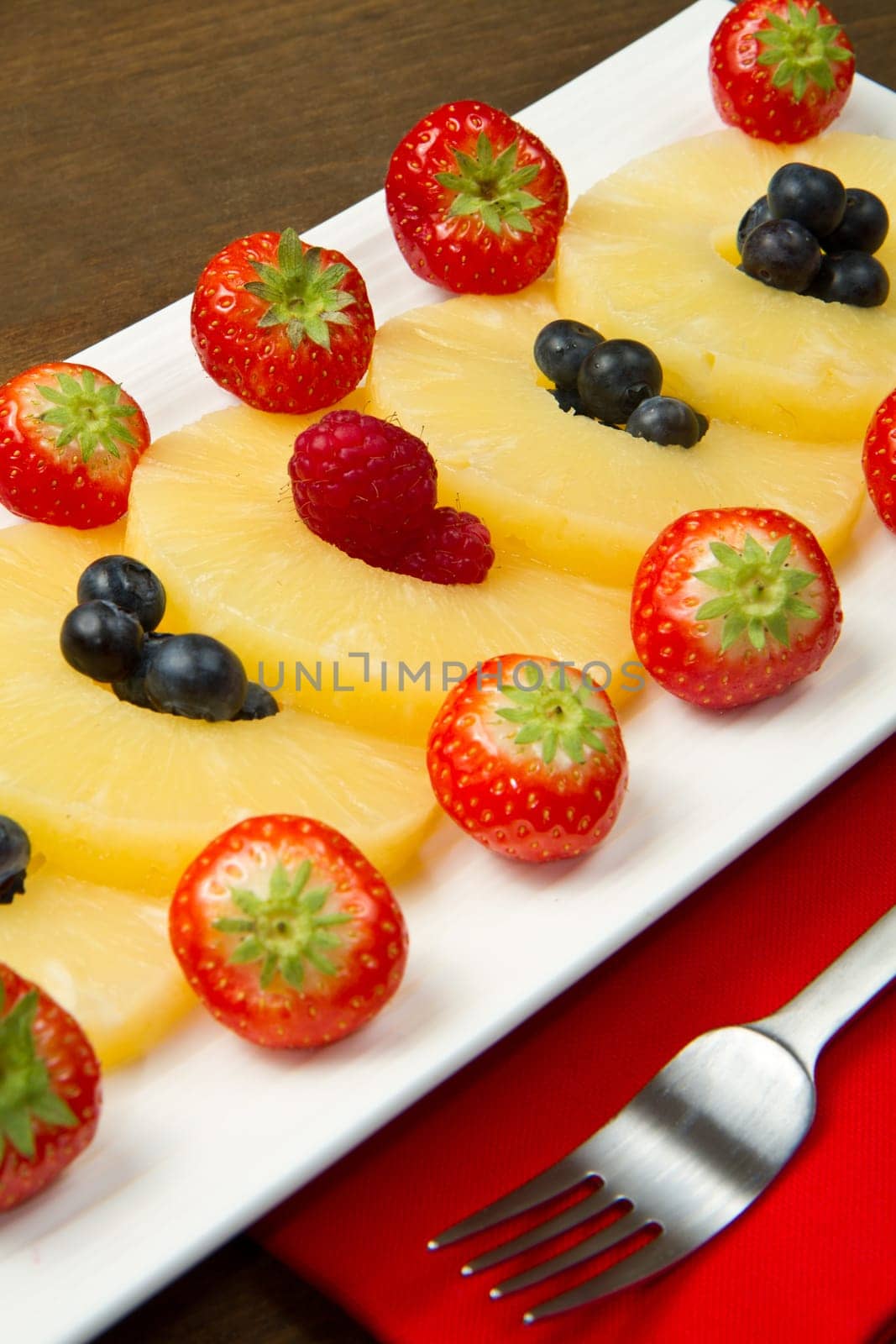 pineapple slices with berries