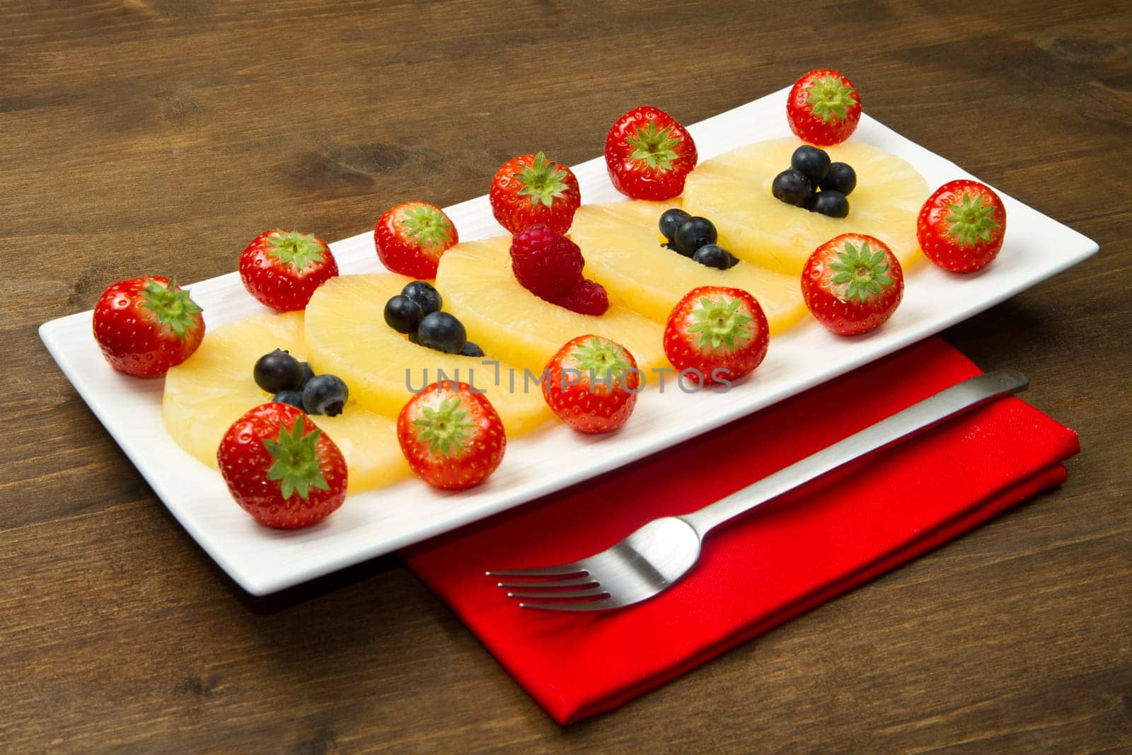 pineapple slices with berries
