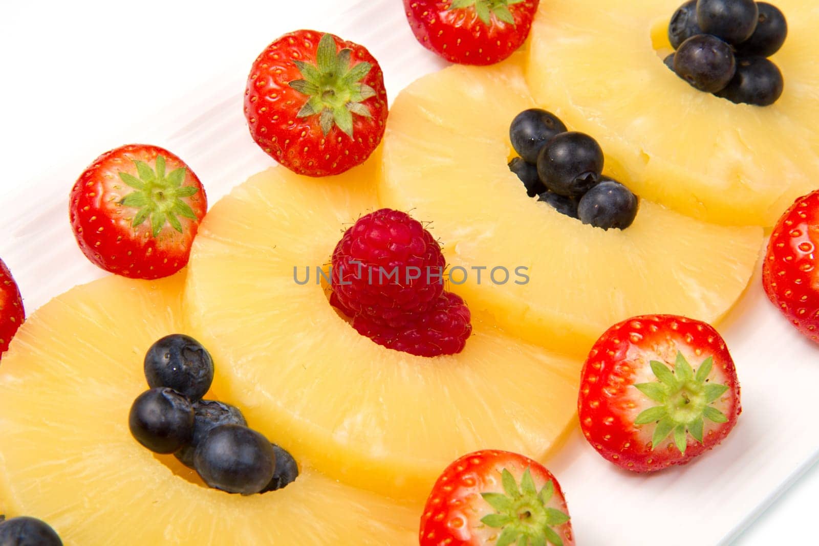 pineapple slices with berries