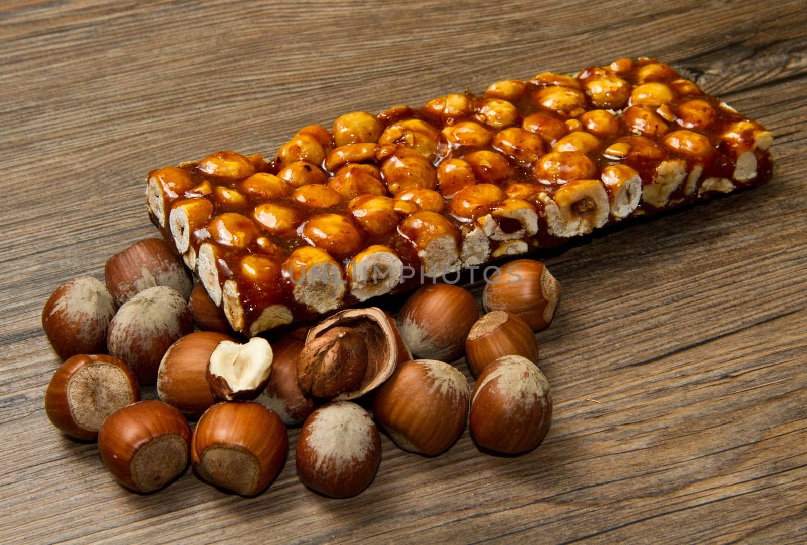 hazelnut brittle on wood with ingredients