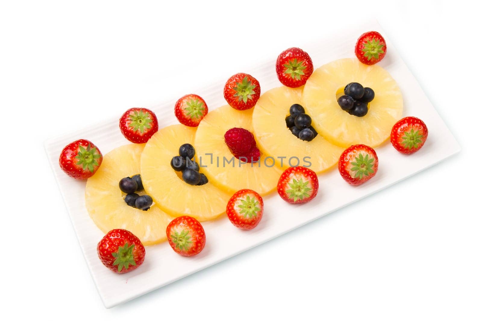 pineapple slices with berries