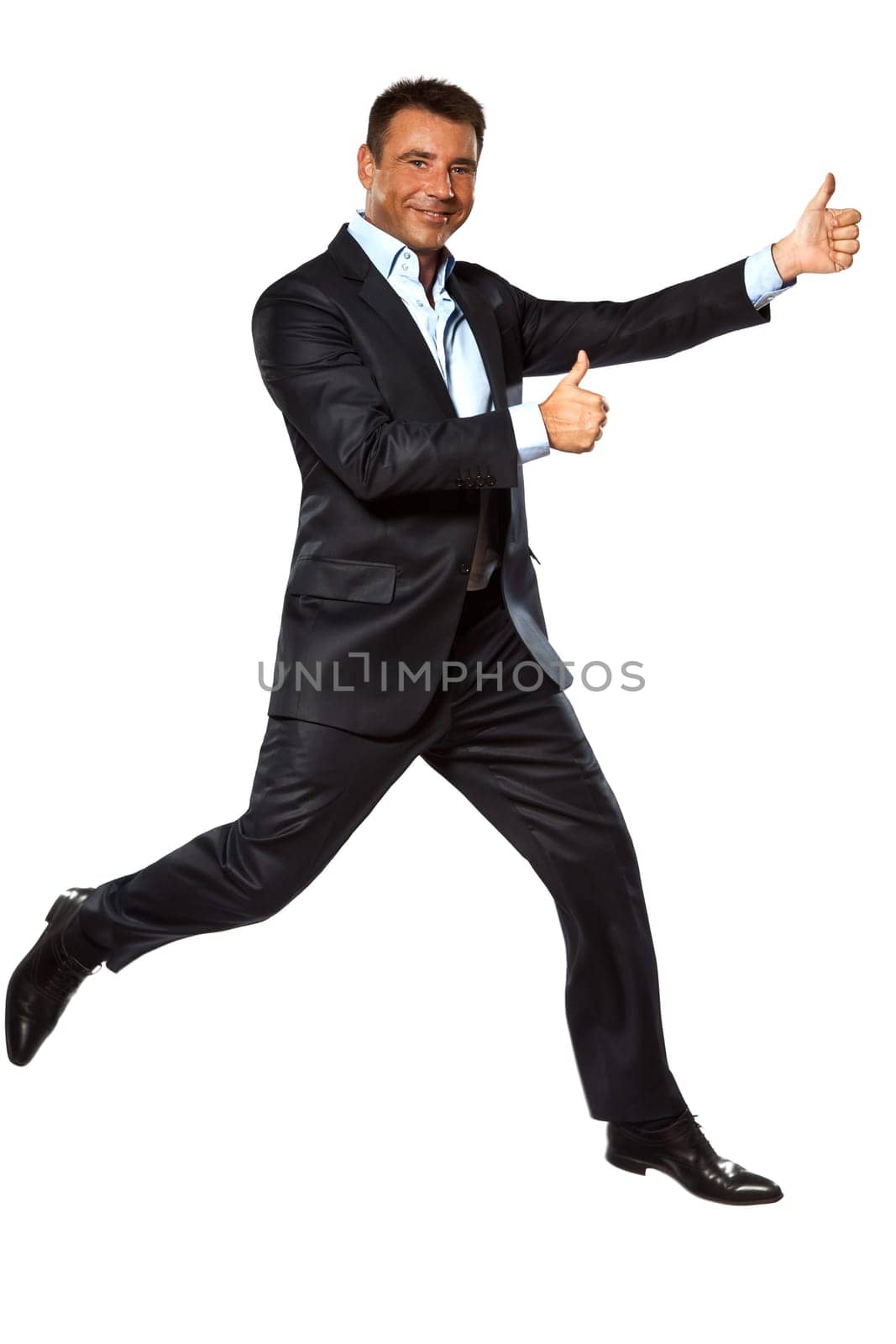 one caucasian business man running jumping double thumbs up in studio isolated on white background