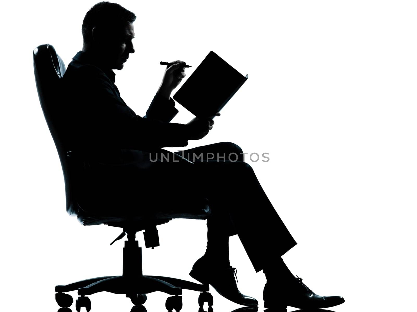 one caucasian business man sitting in armchair silhouette Full length in studio isolated on white background