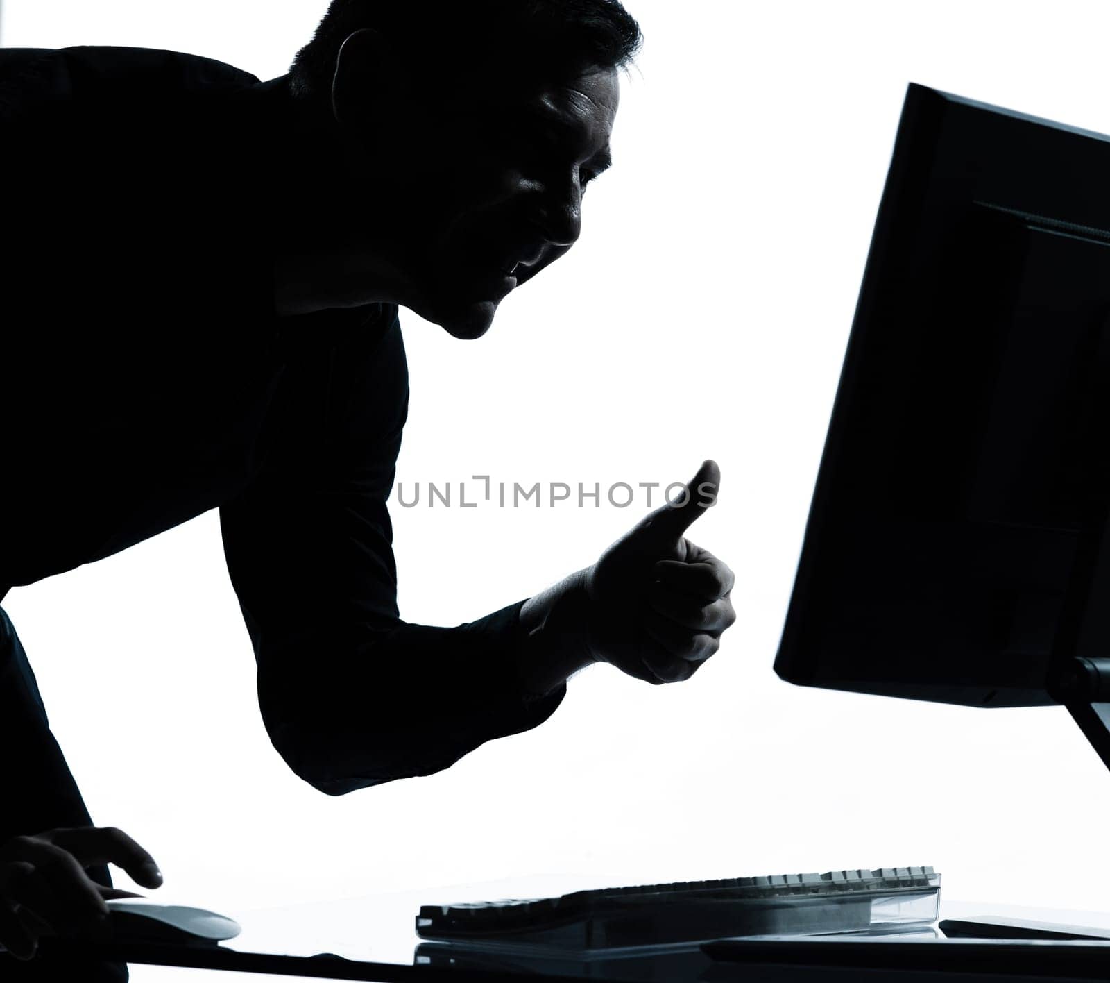 one caucasian business man computing computer thumb up satisfied portrait silhouette in studio isolated on white background