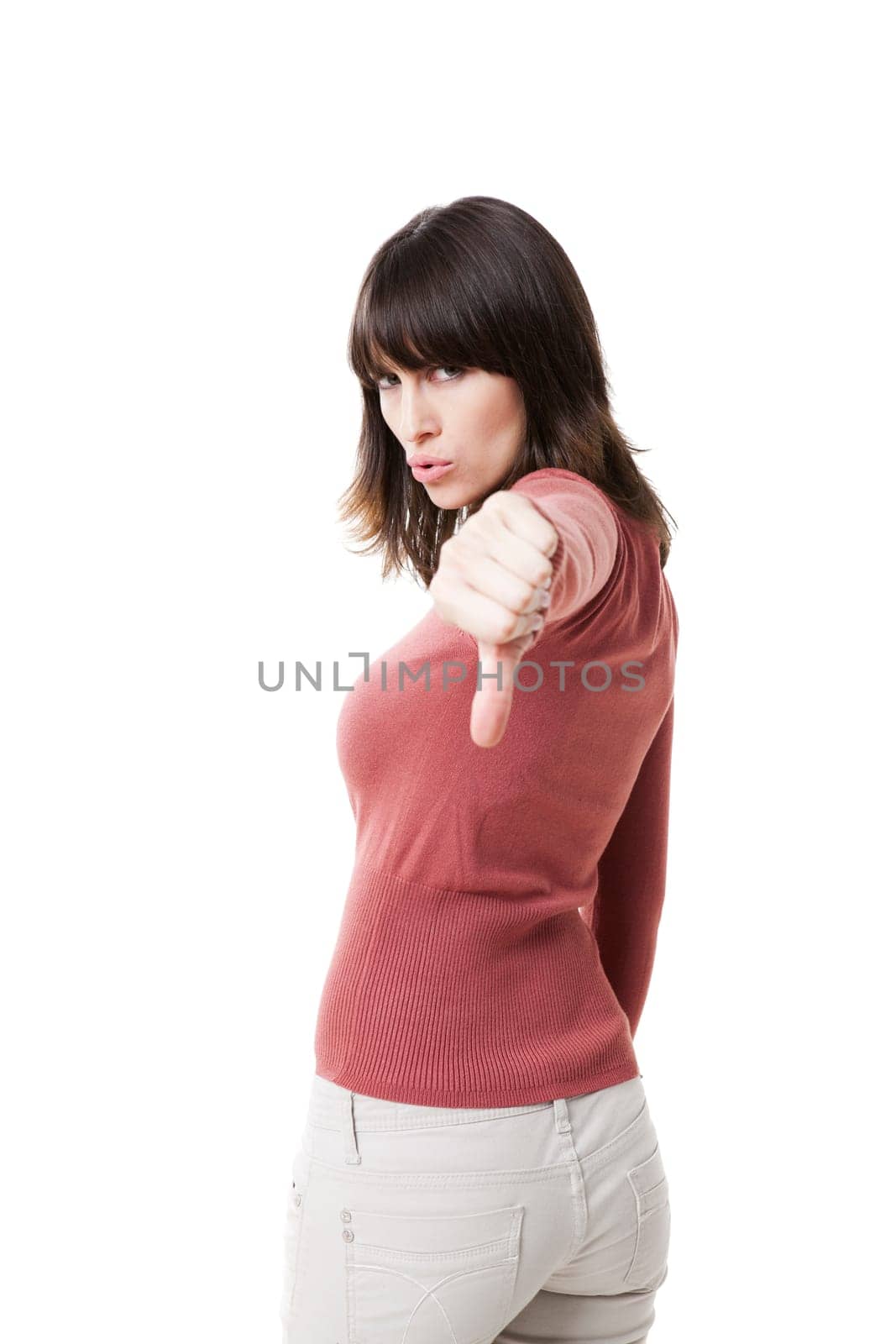 Beautiful woman with thumbs down, isolated against a white background