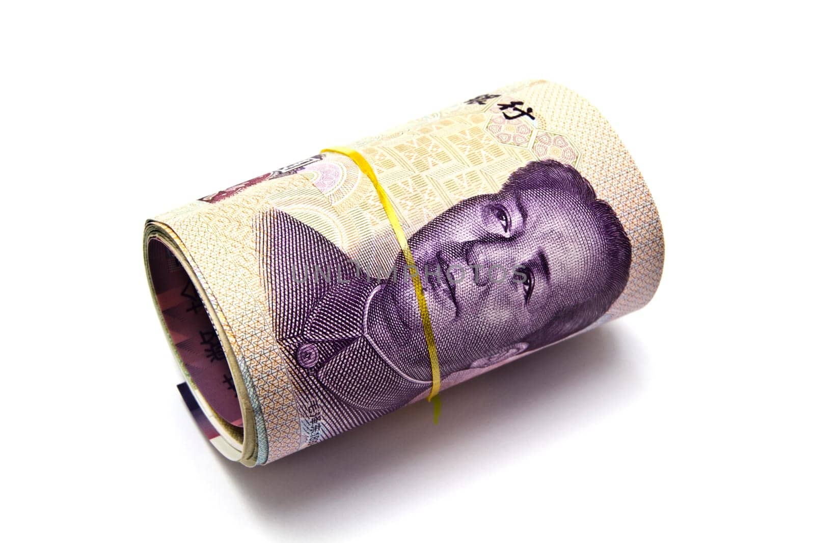 Roll of chinese money closeup on white background