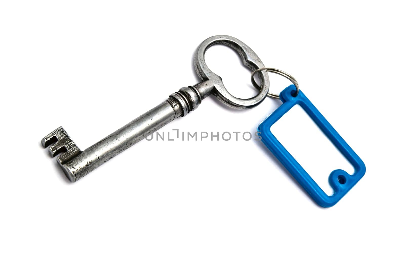 Blank tag and old key isolated on white background