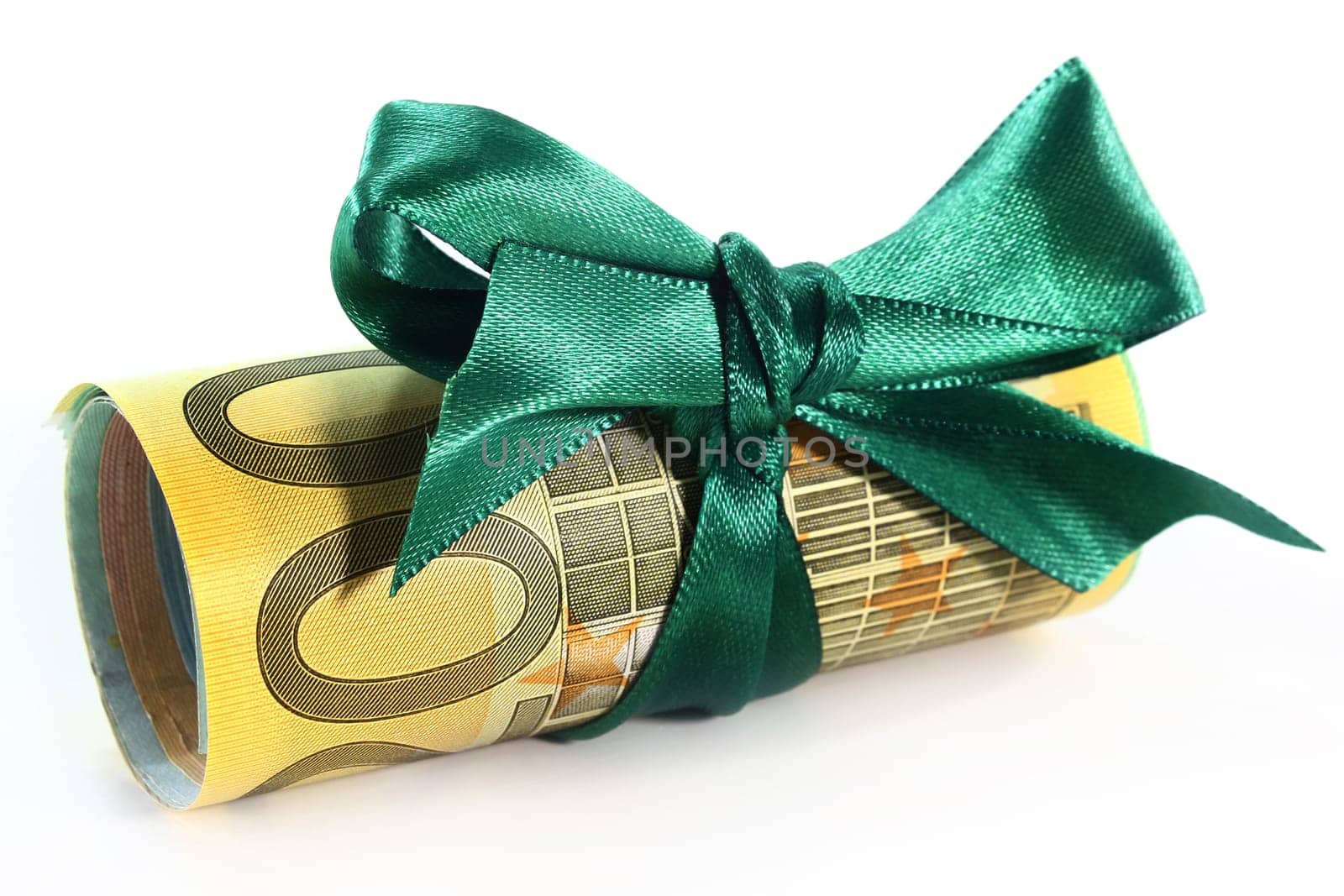 rolled euro bills with a green bow