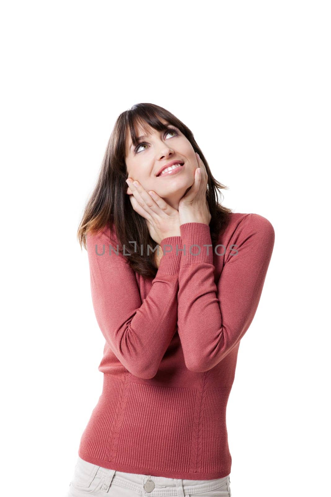 Beautiful woman smiling and looking up. Studio shot with isolated white background.