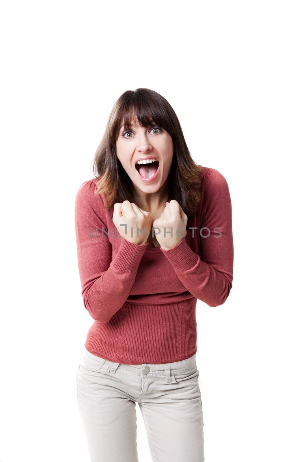 Beautiful woman screaming. Studio shot isolated on a white background.
