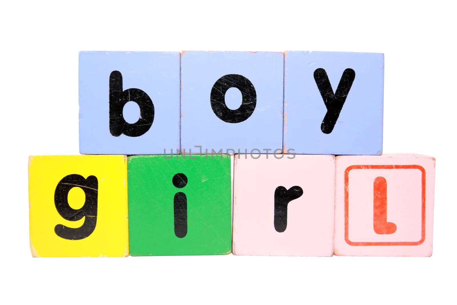 assorted childrens toy letter building blocks against a white background that spell boy girl with clipping path