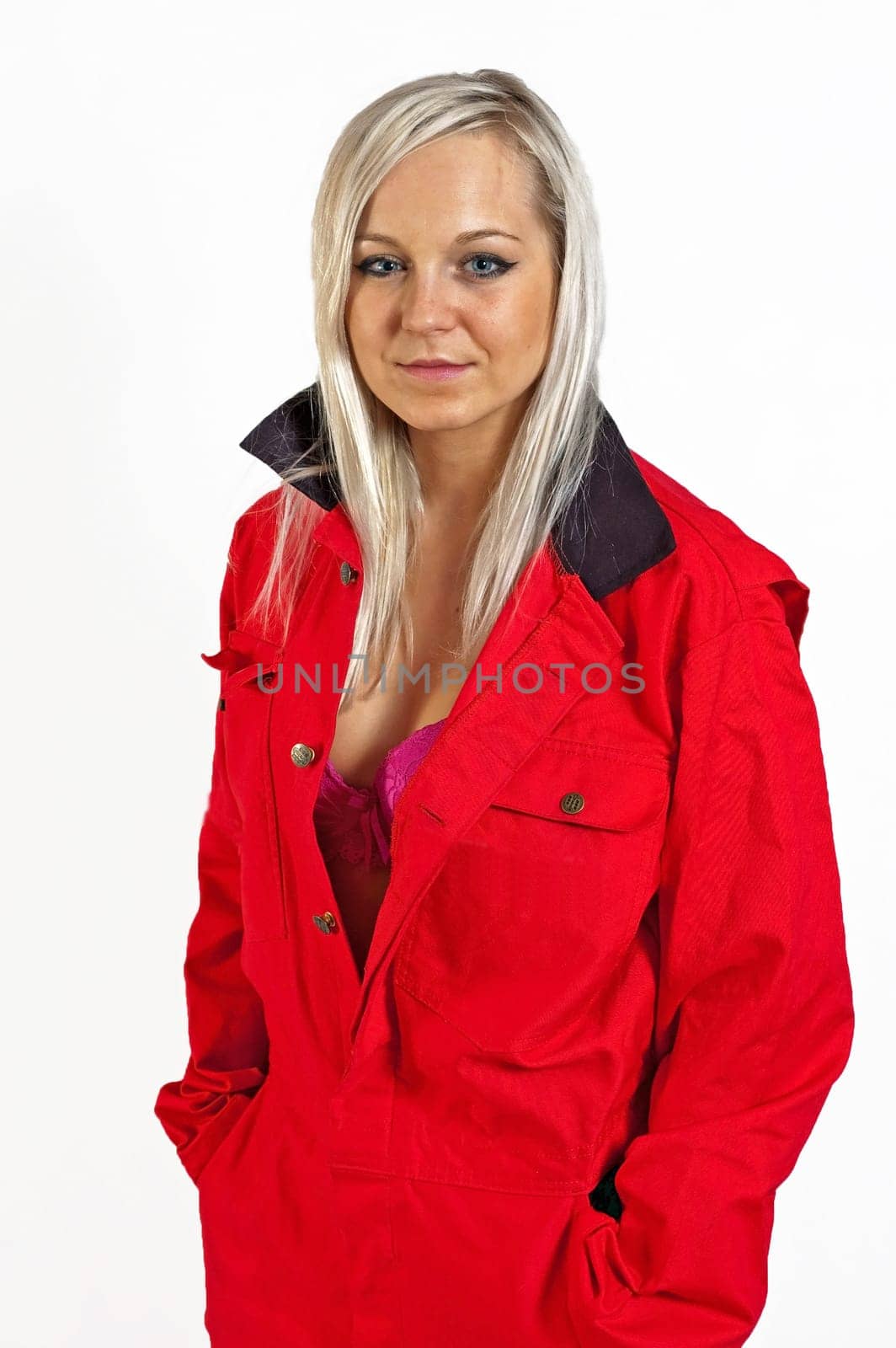 young woman builder in white helmet holding driller