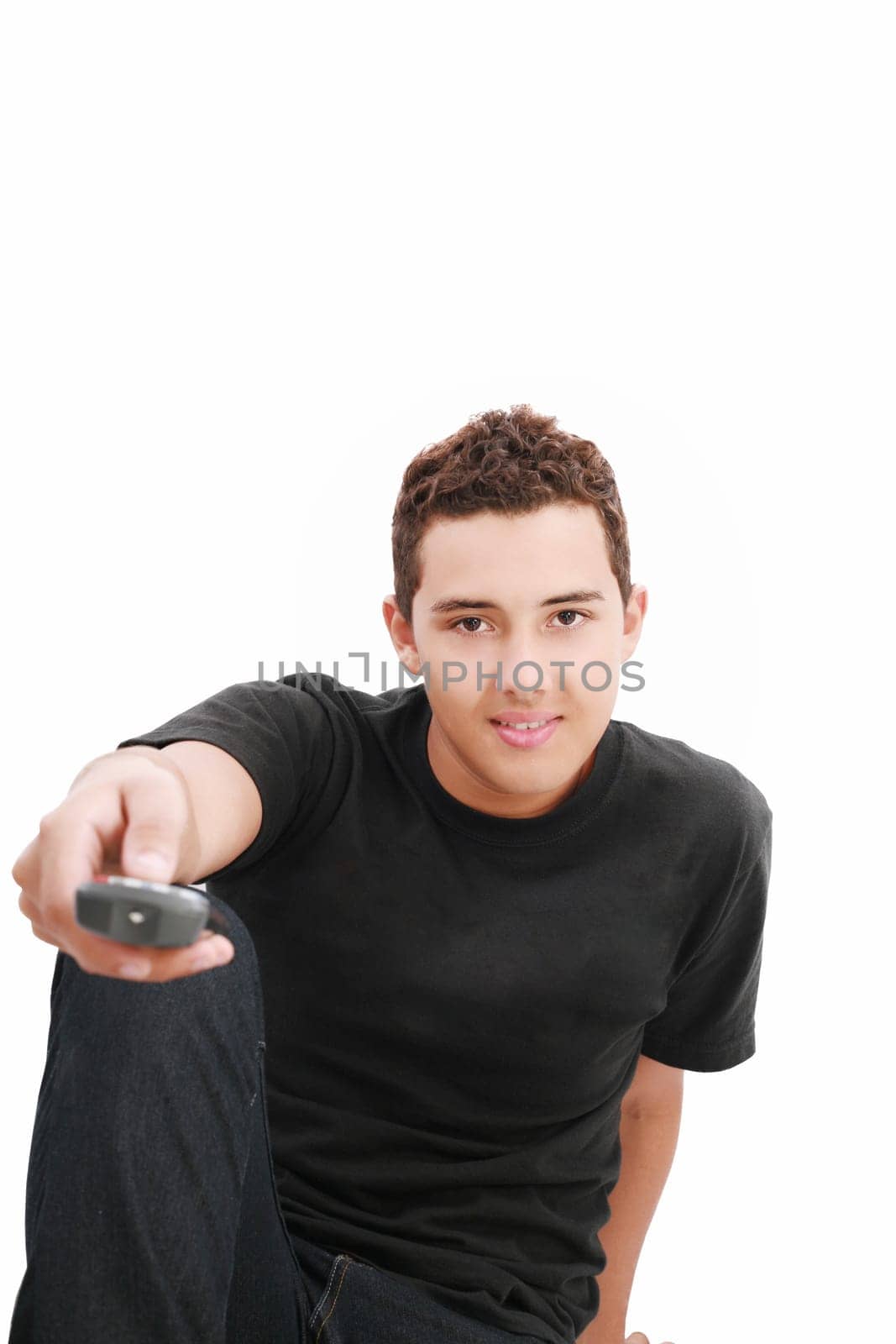Teenage boy with TV remote control