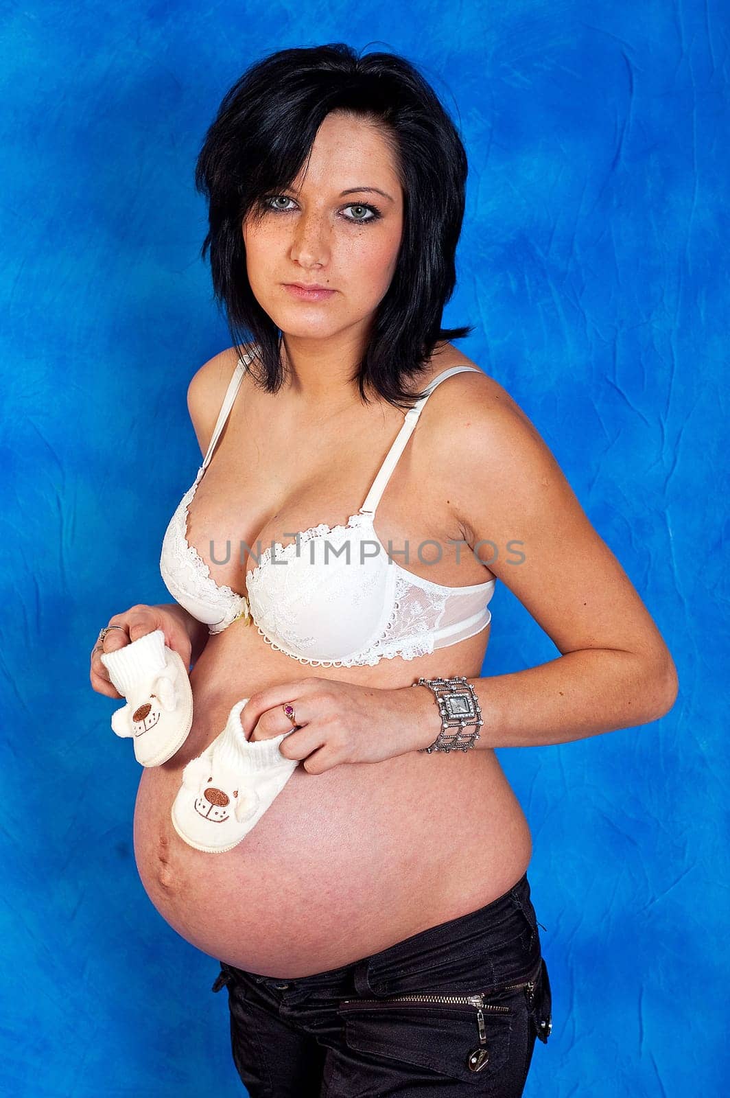 Pregnant woman on the blue mosaic background
