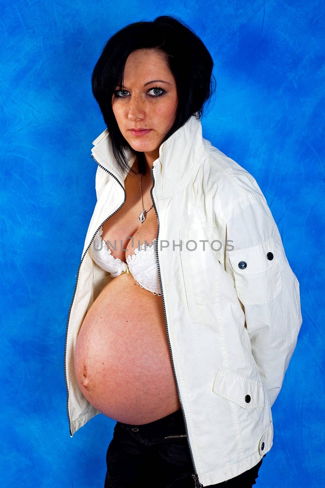 Pregnant woman on the blue mosaic background