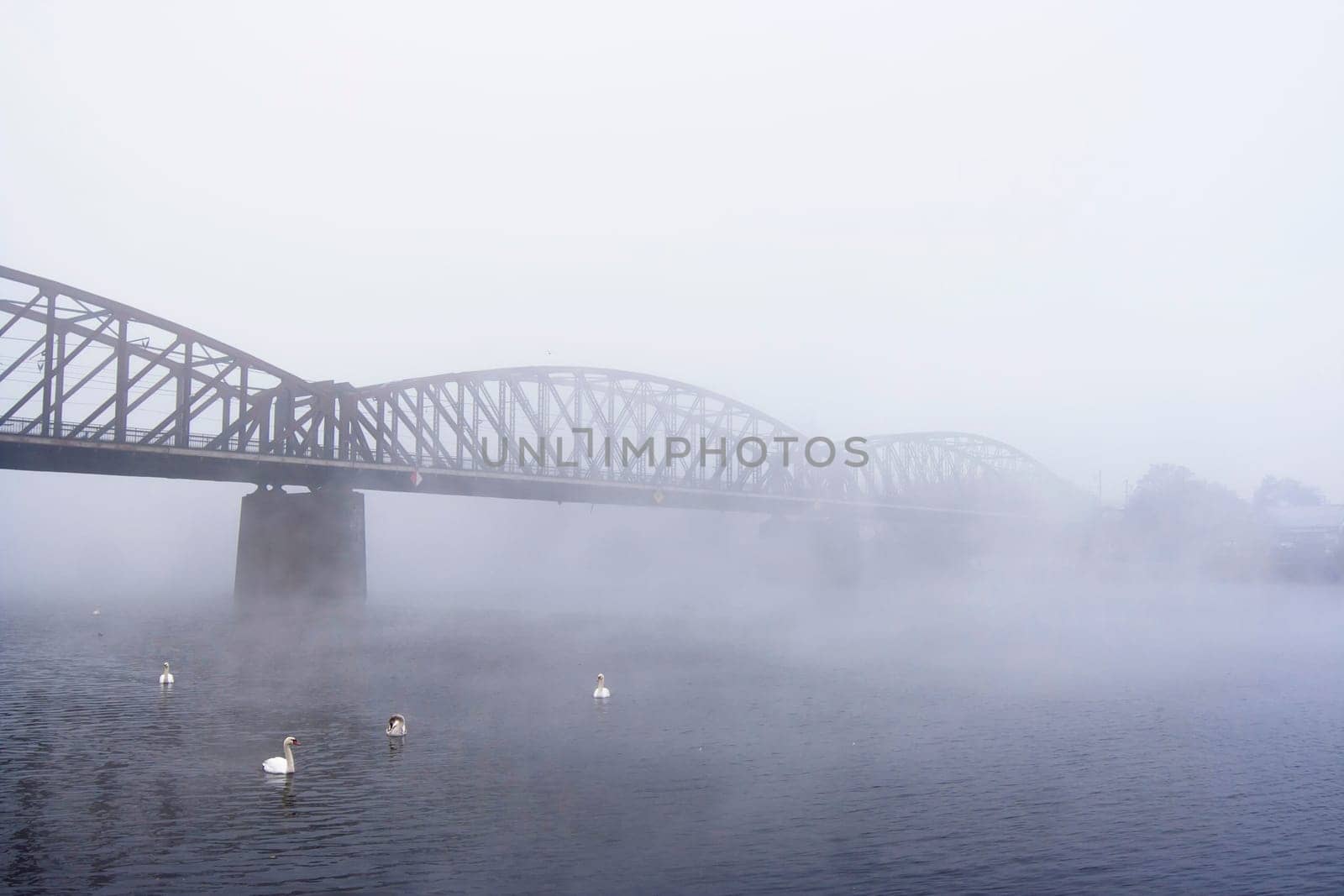 Prague railway bridge in the foggy day