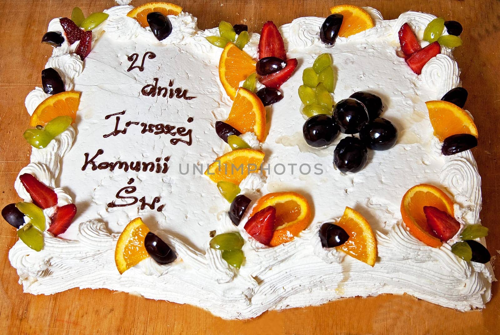Holy Communion layer cake with fruits on the decorative board
