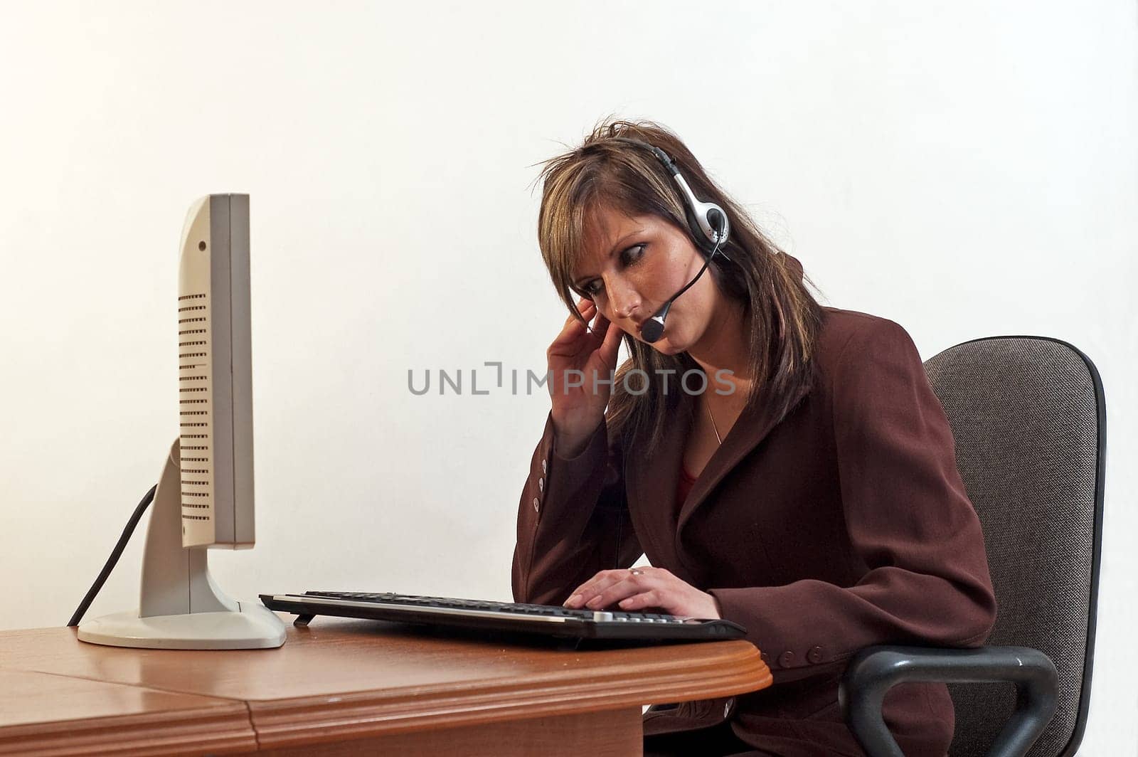 Young happy beautiful customer service operator girl in headset, smiling, isolated on white background.