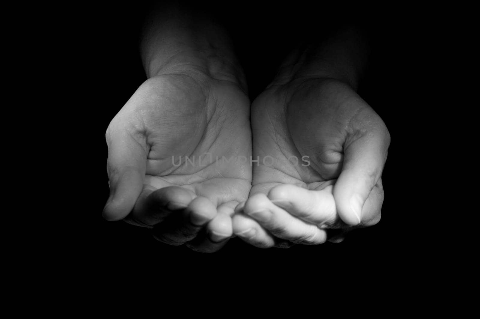Two hands ask the charity from foto watcher
