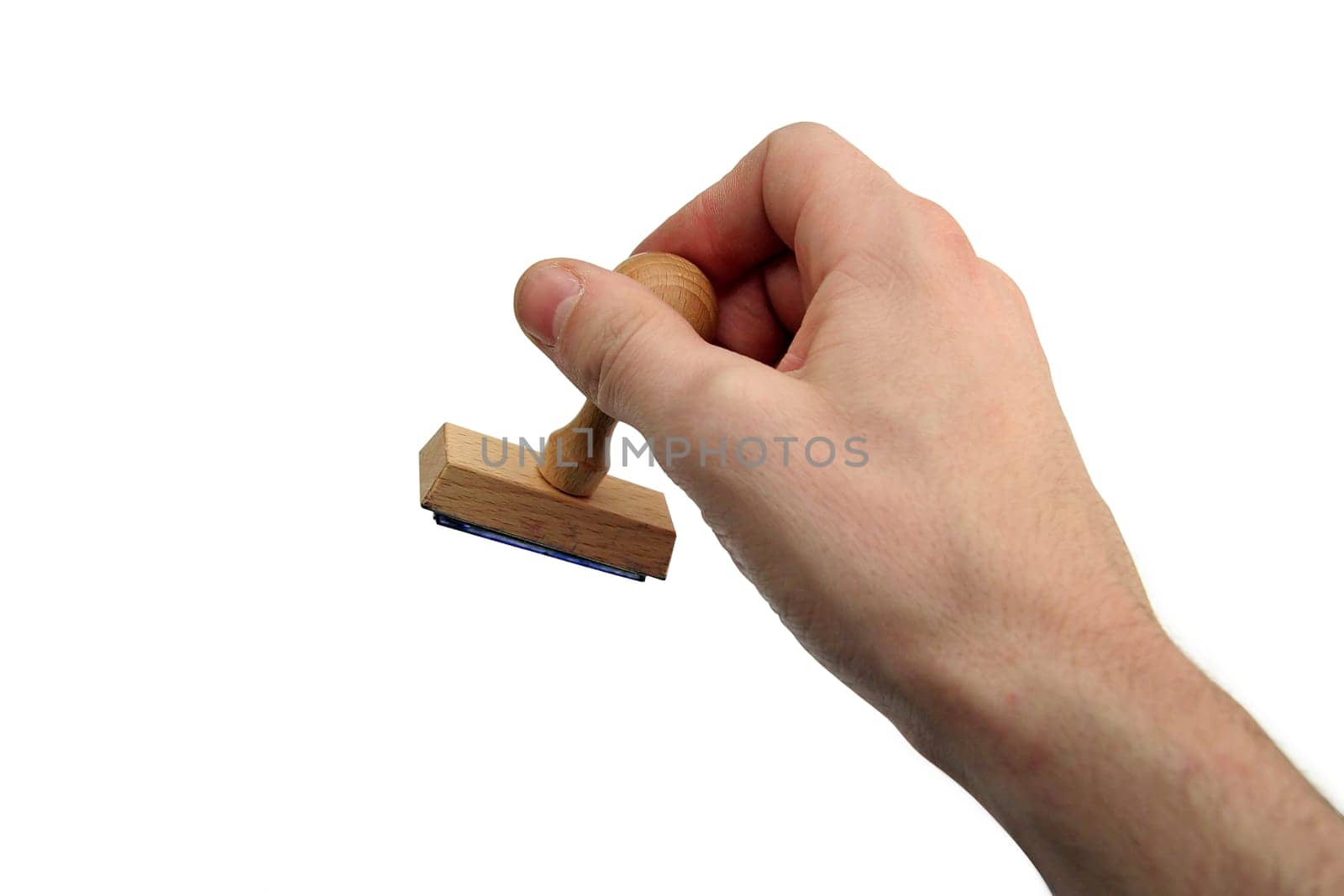 man hand holding a wooden stamp. white background