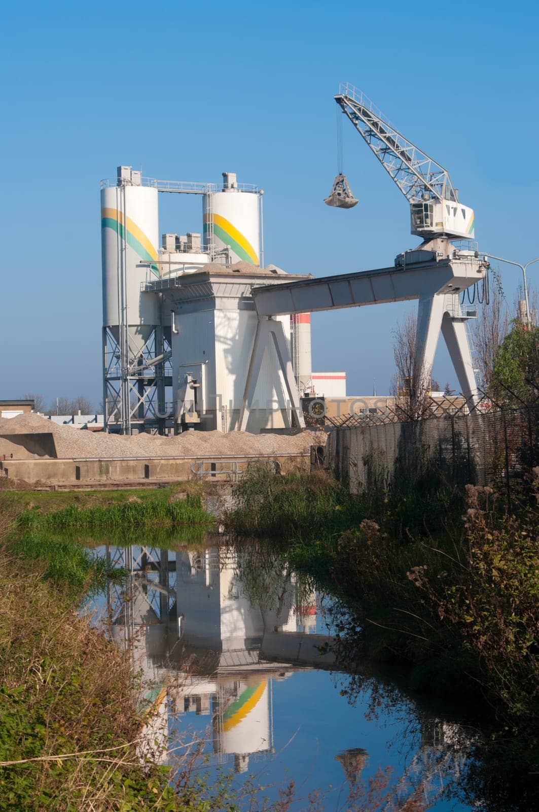 cement factory reflected in a canal in Hengelo, Netherlands