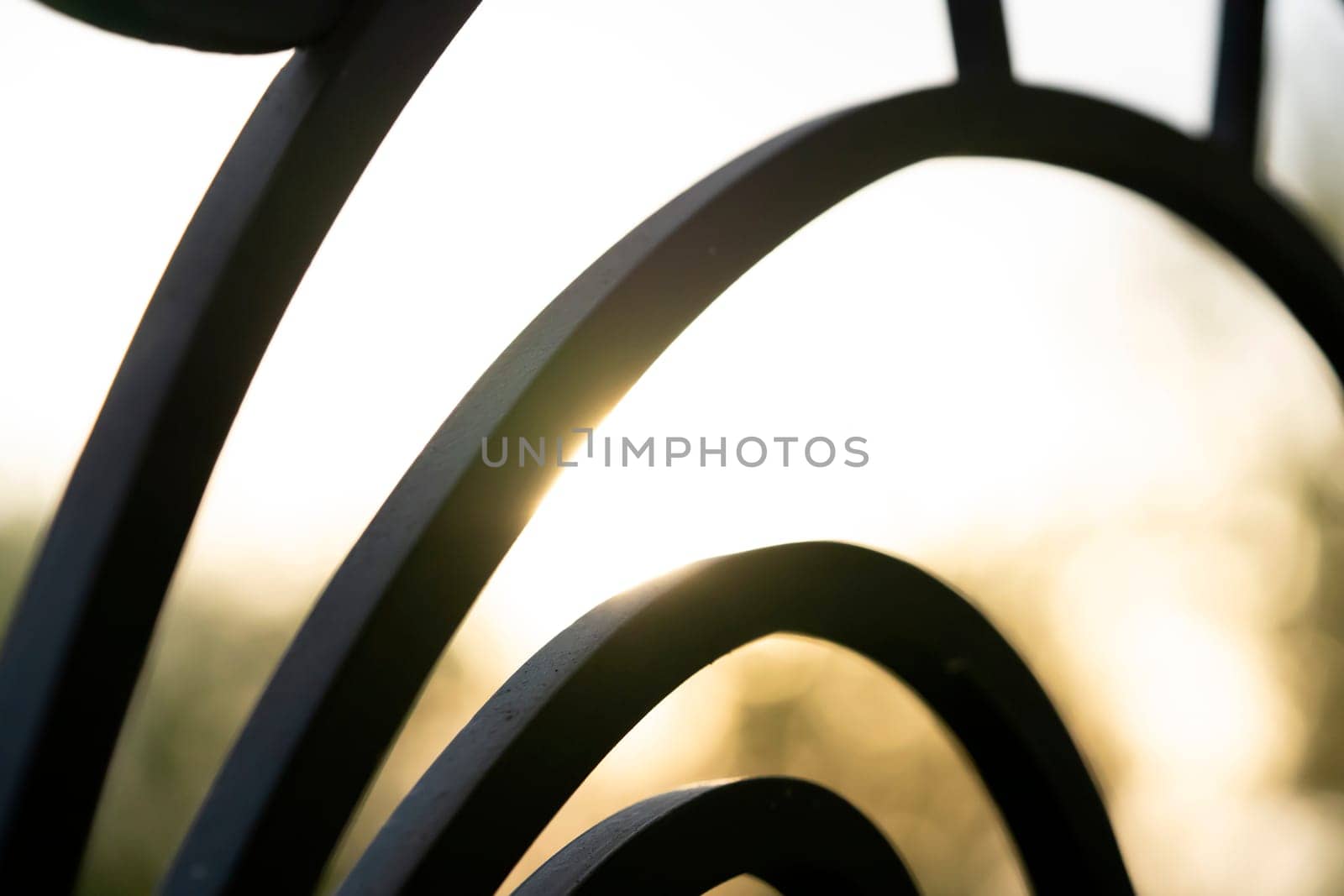 Curved forged modern fence on the balcony closeup. by africapink