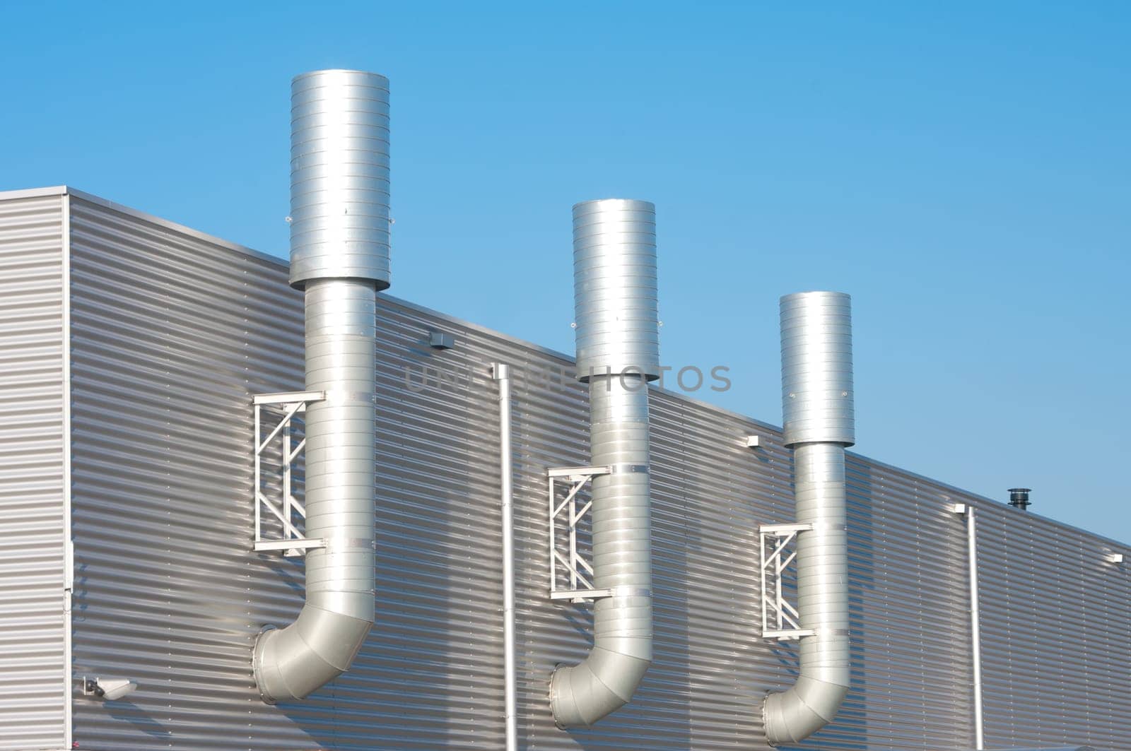 three chimneys on an industrial building