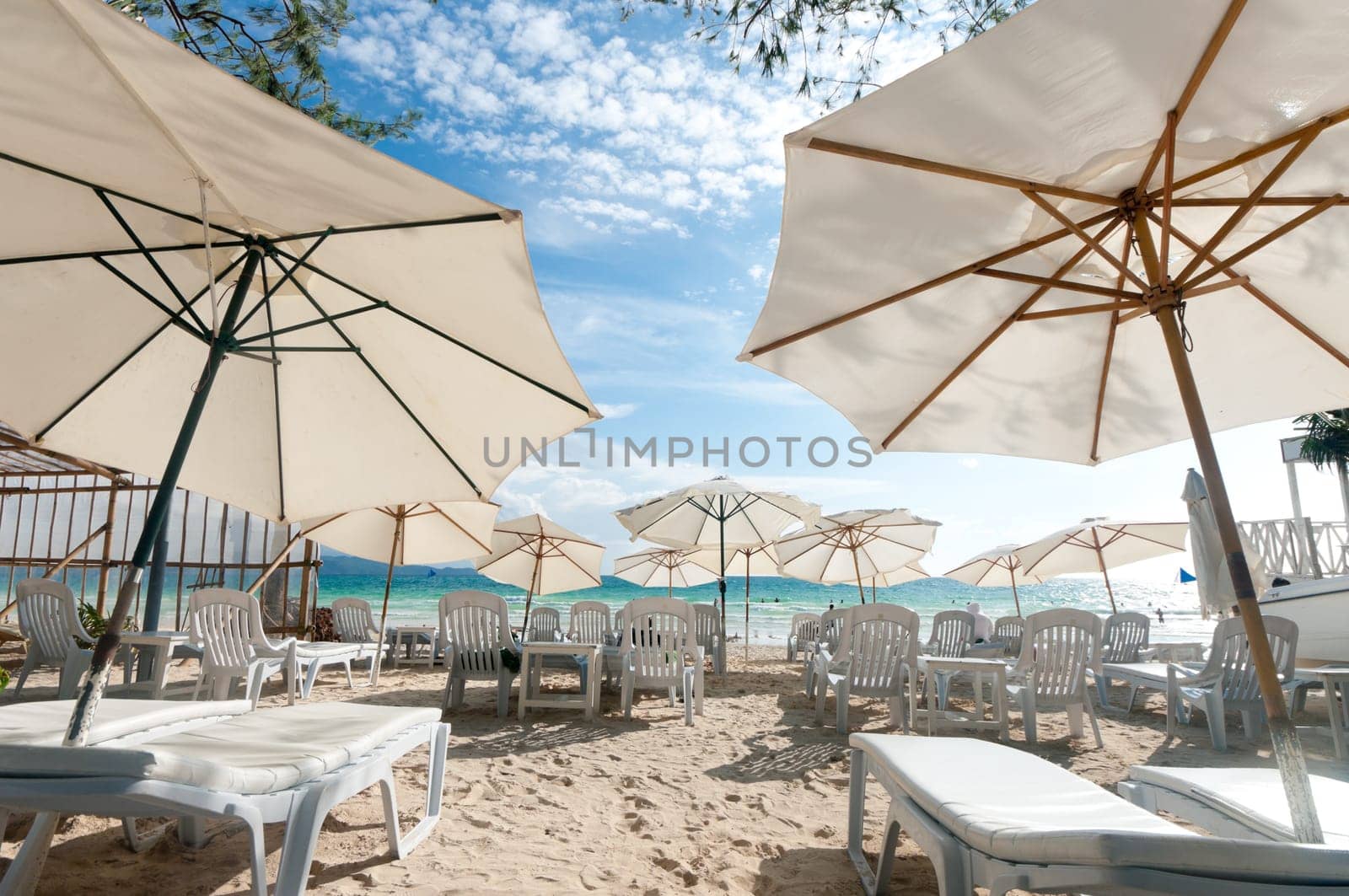 white parasols on a tropical beach