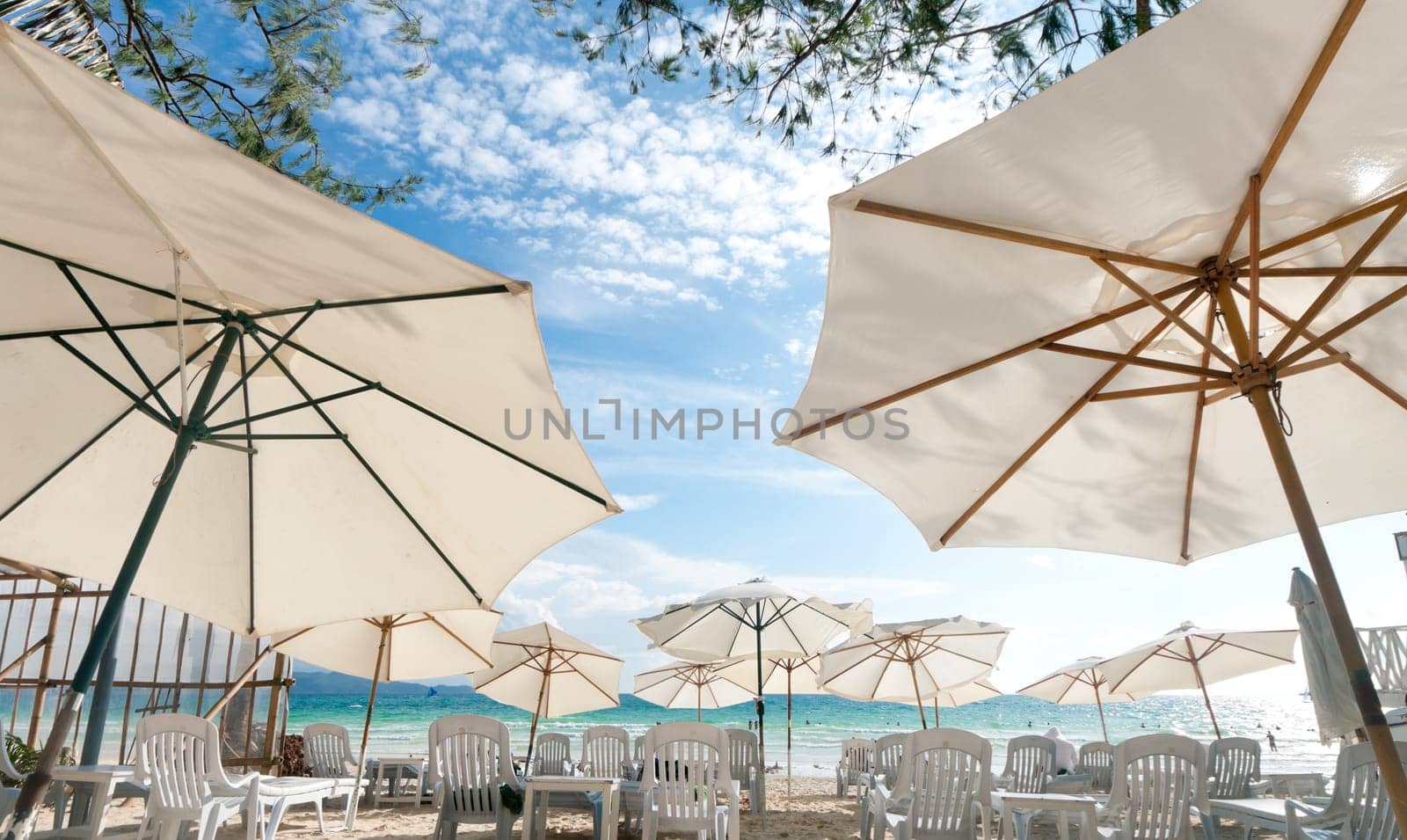 white parasols on a tropical beach