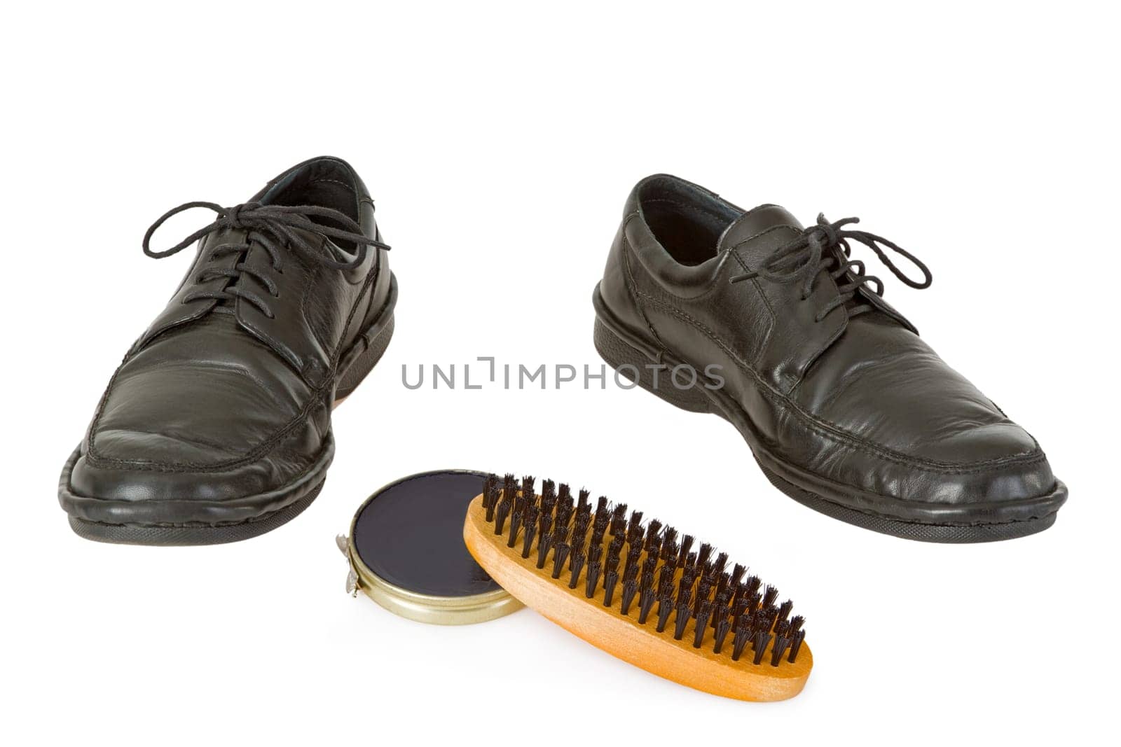 Men's shoes and shoe cerme isolated on white background