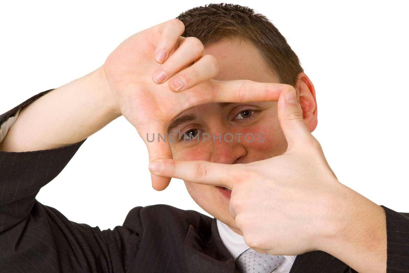 Young man holding his hands in front of his face
