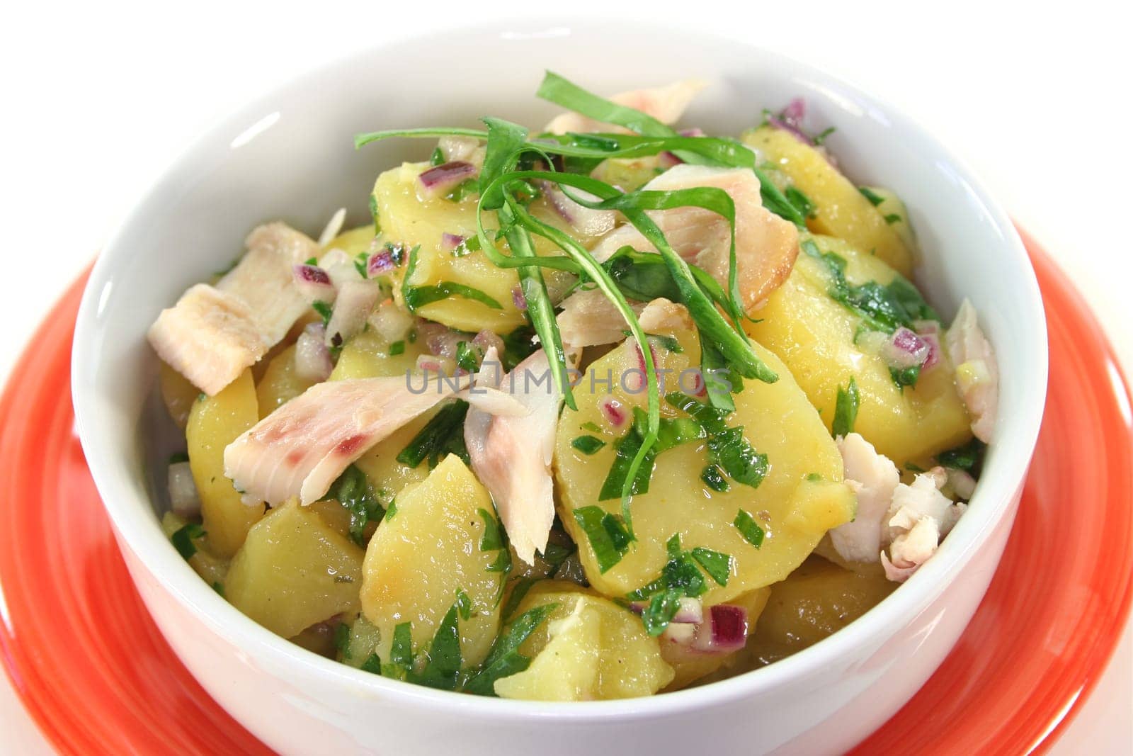 Wild garlic and potato salad with smoked fish